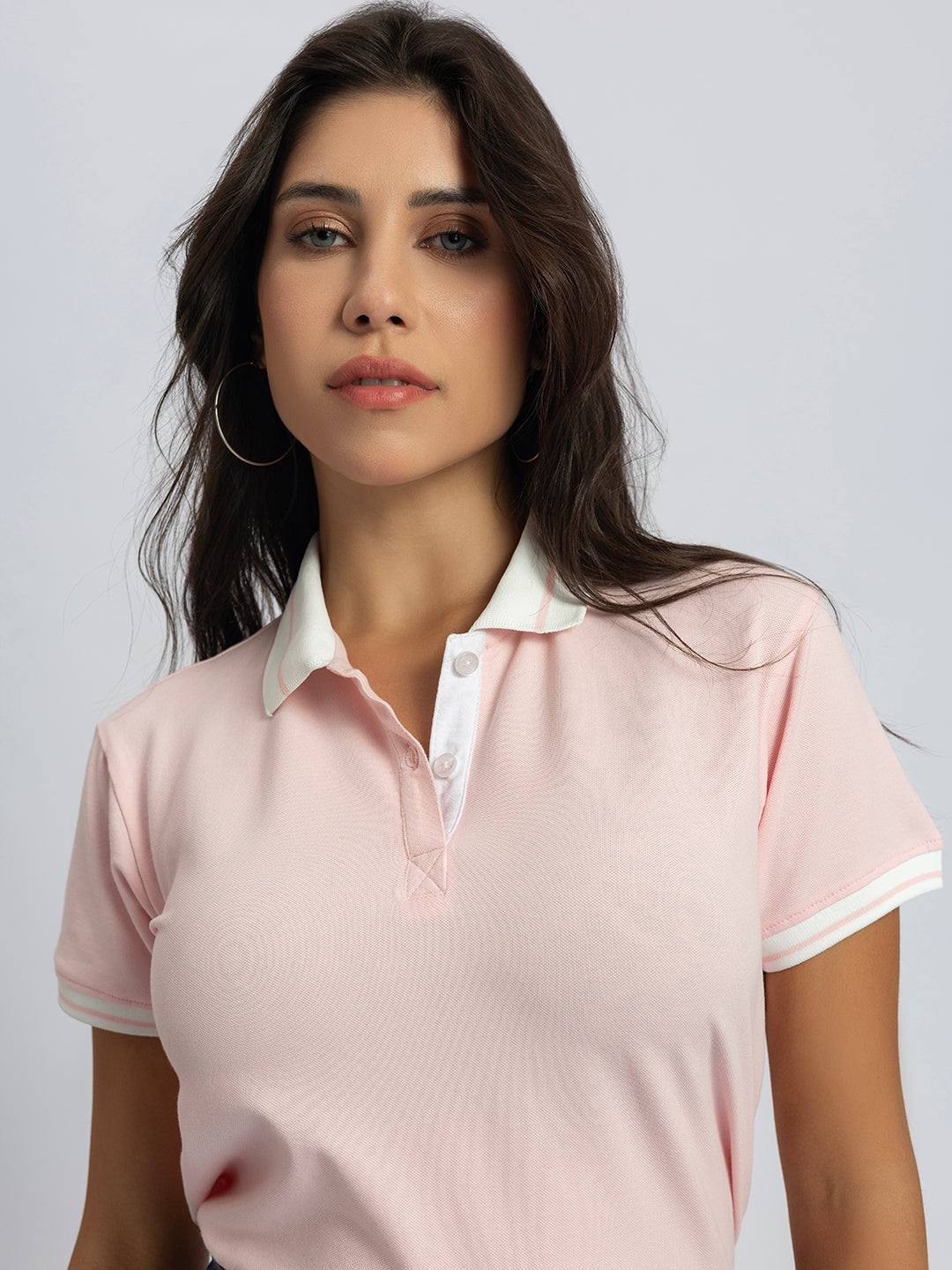 Folded light pink cotton polo T-shirt detail