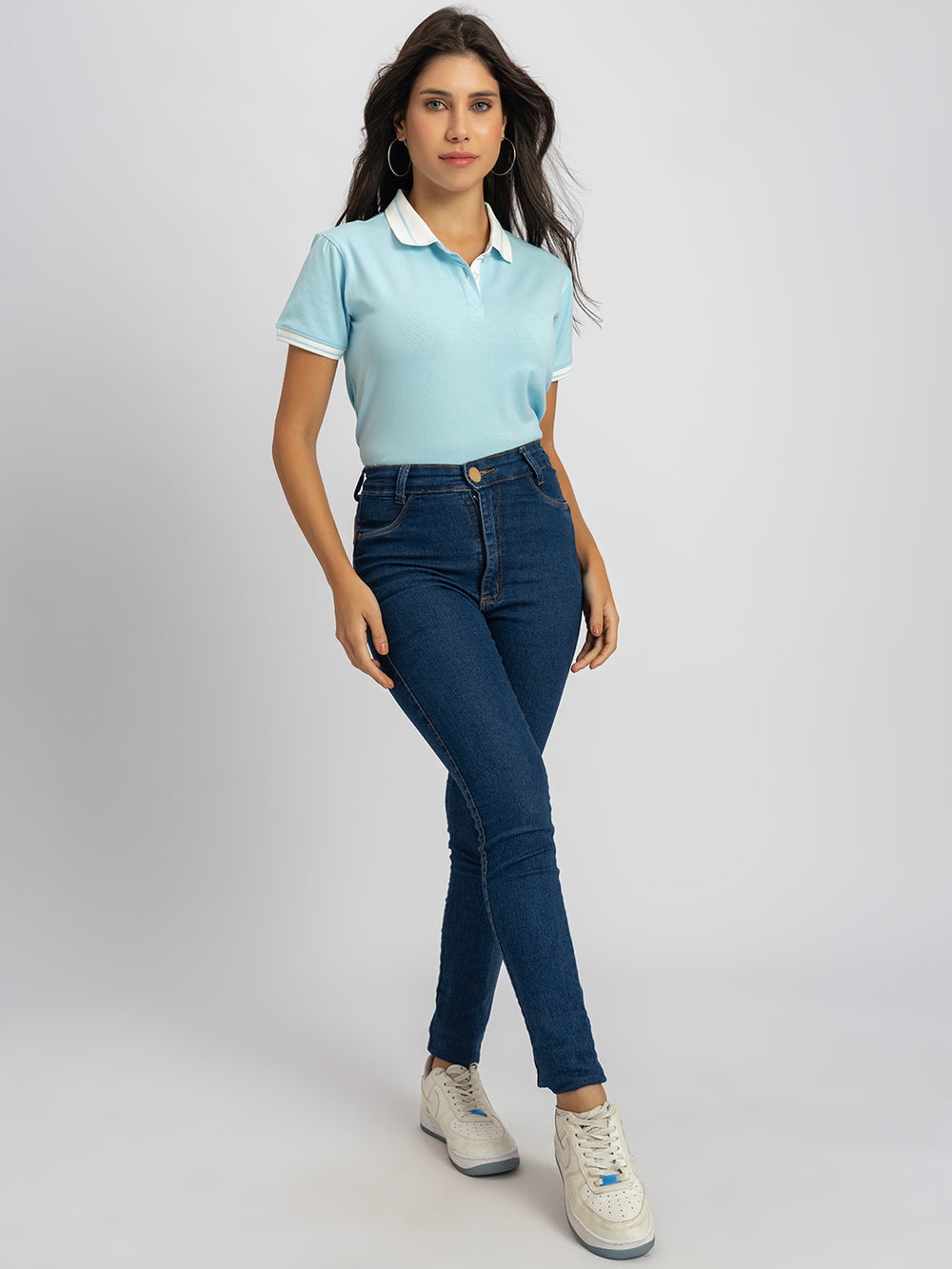 Side view of sky blue polo T-shirt with striped collar