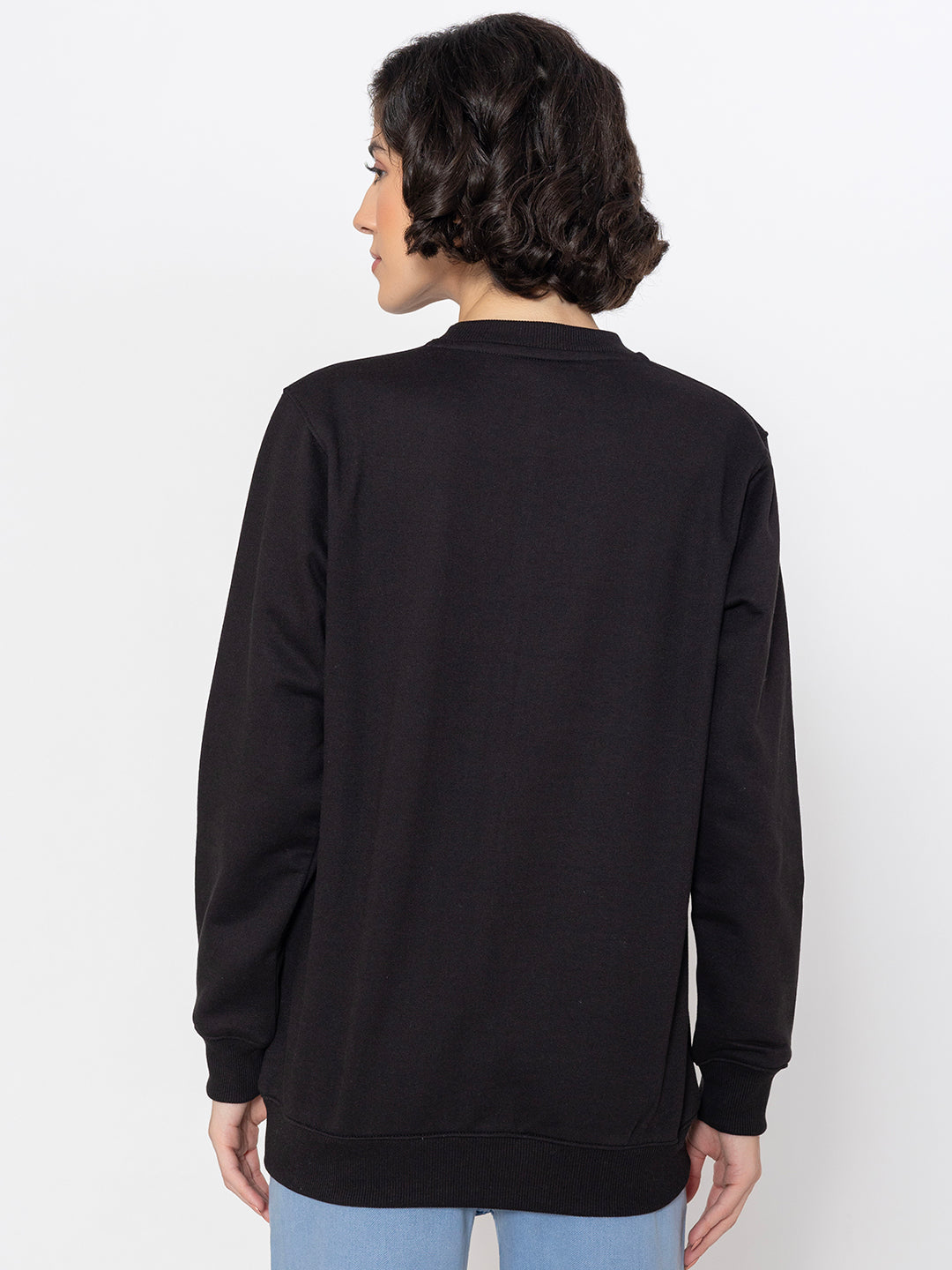 Black cotton sweatshirt shown in soft daylight