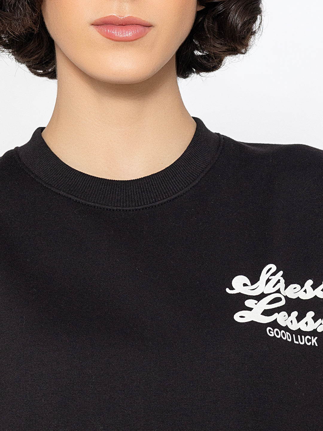 Lifestyle shot of black sweatshirt with jeans