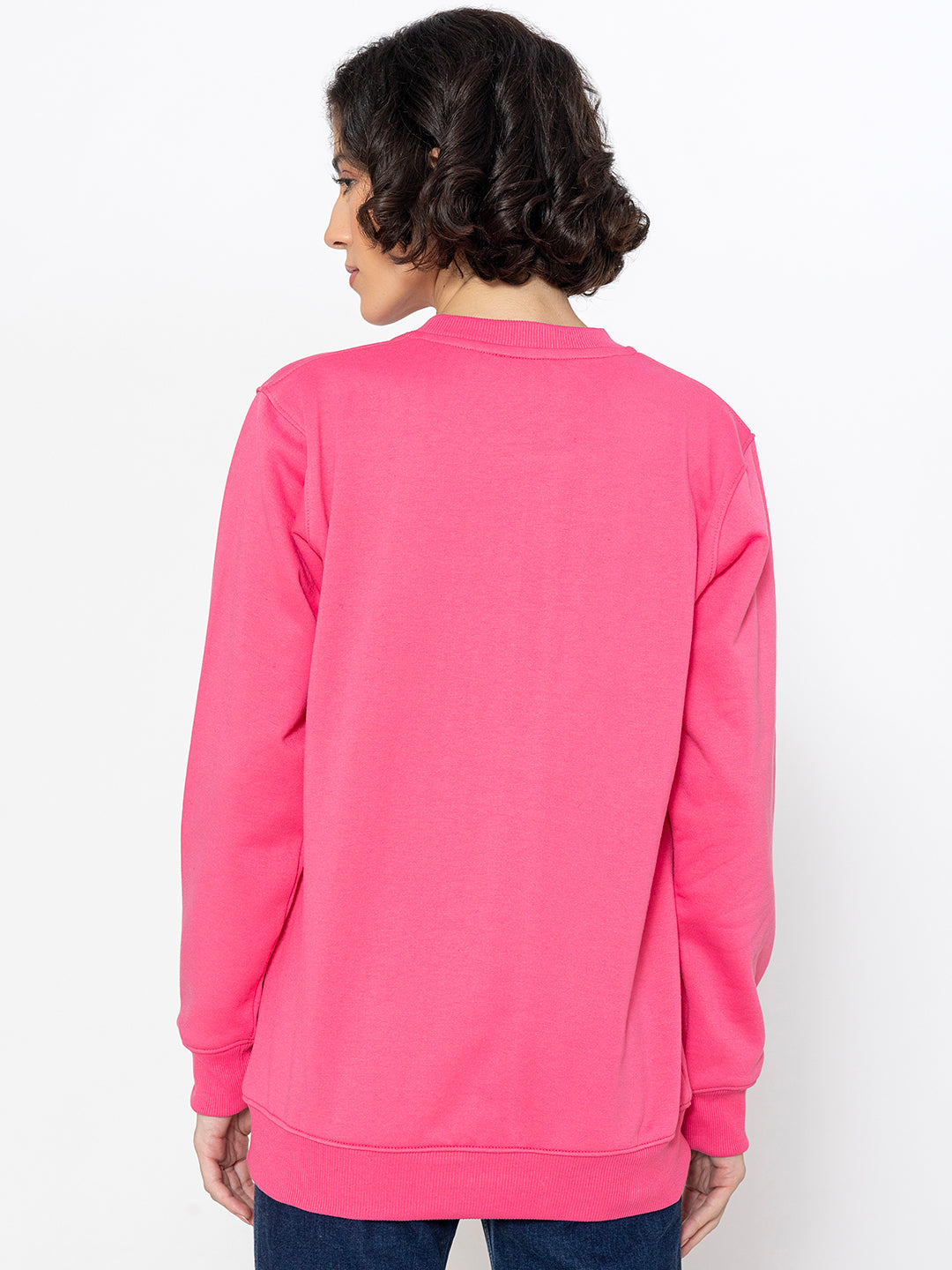 Pink cotton sweatshirt shown in soft daylight