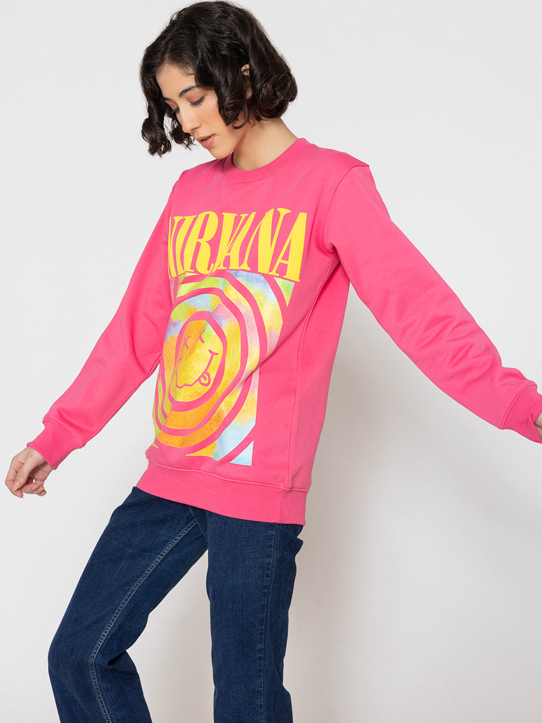 Close-up of graphic print on pink sweatshirt