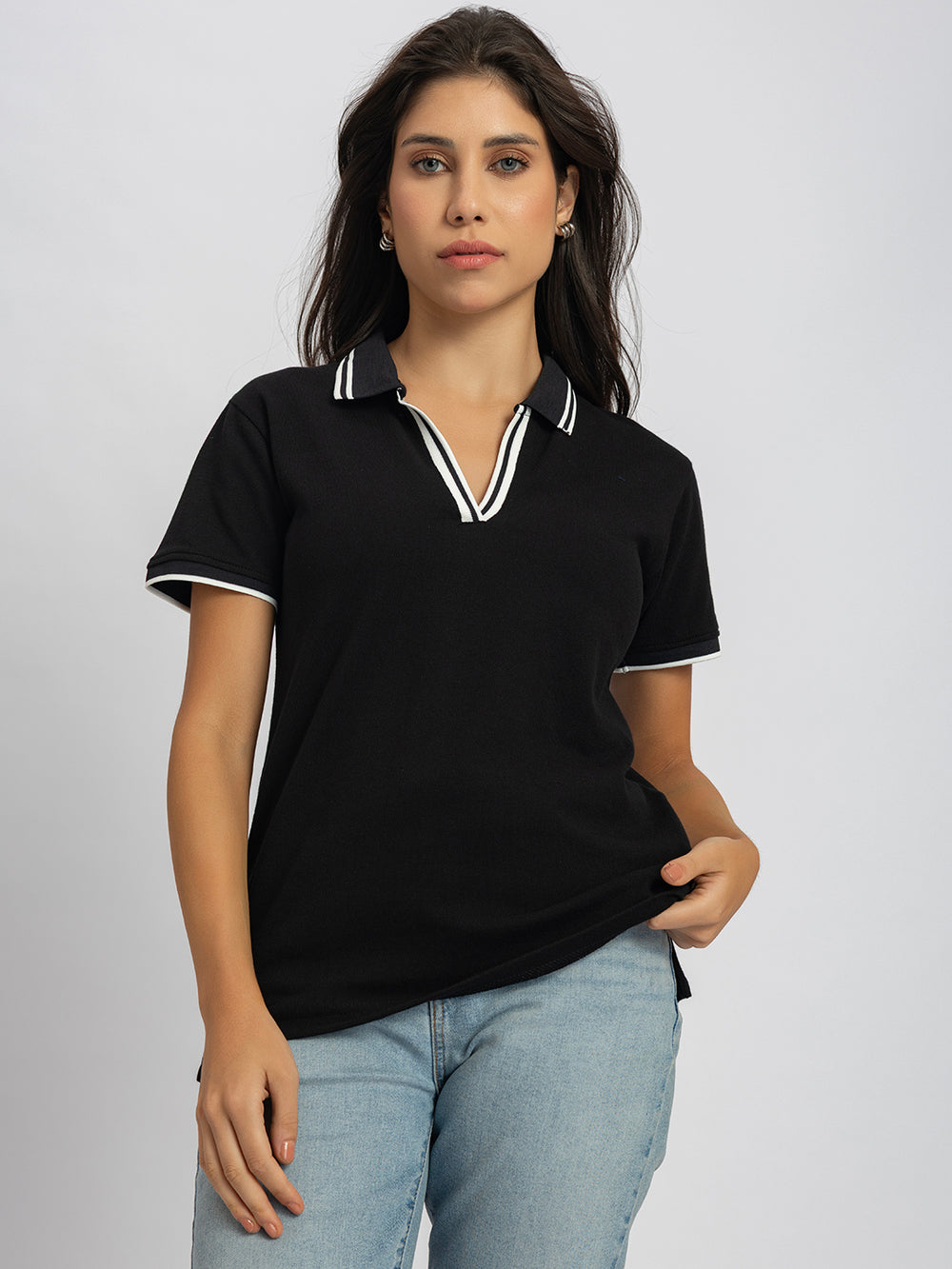 Side view of black polo T-shirt with striped collar