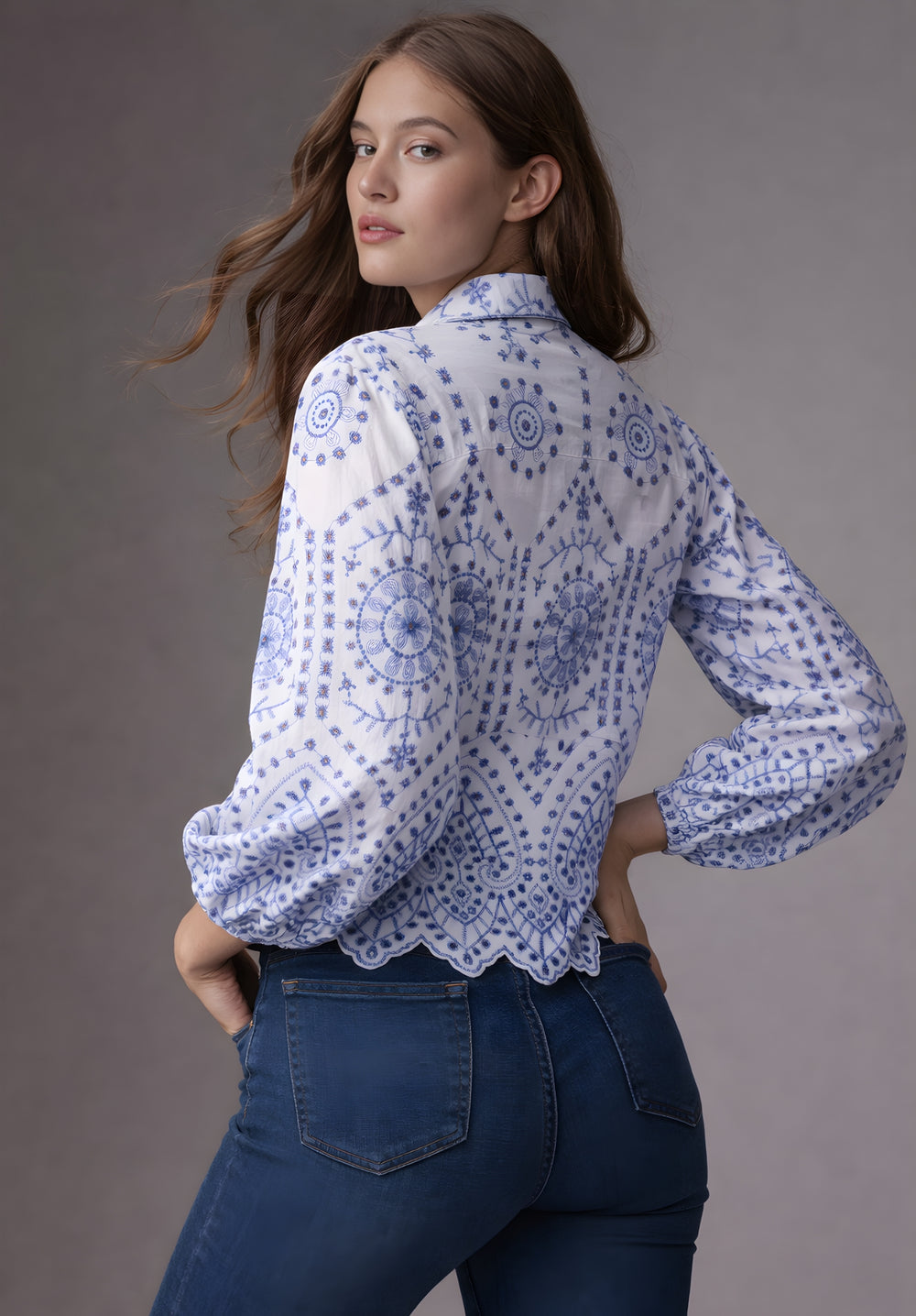 Side view of white shirt with blue Schiffli embroidery