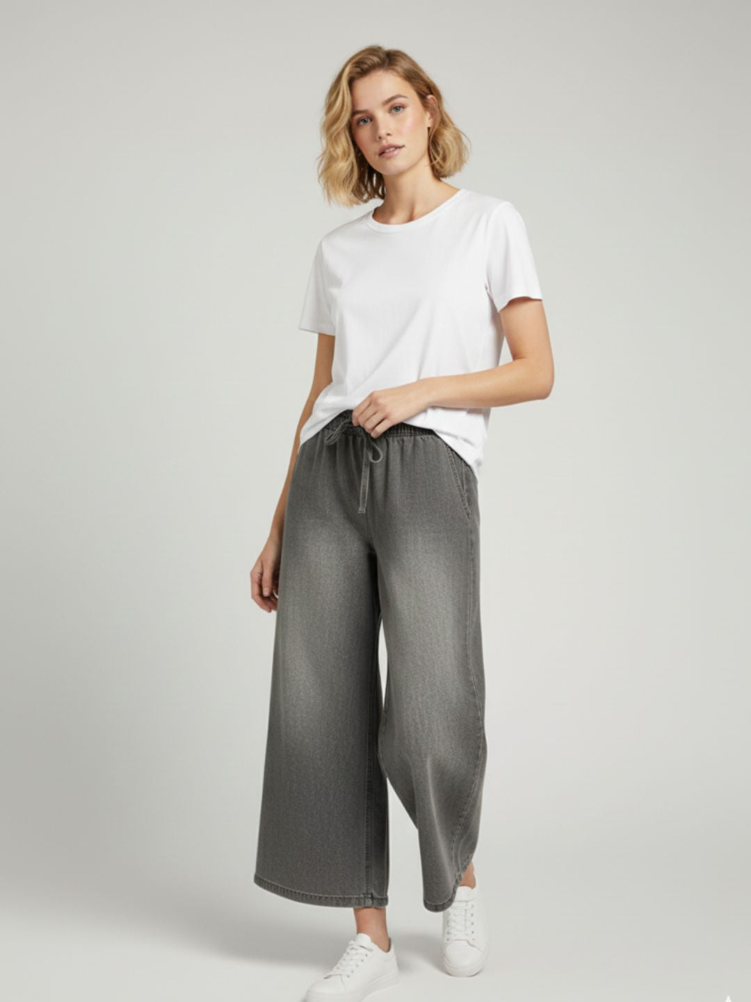 Back view of grey straight-leg cotton drawstring trousers