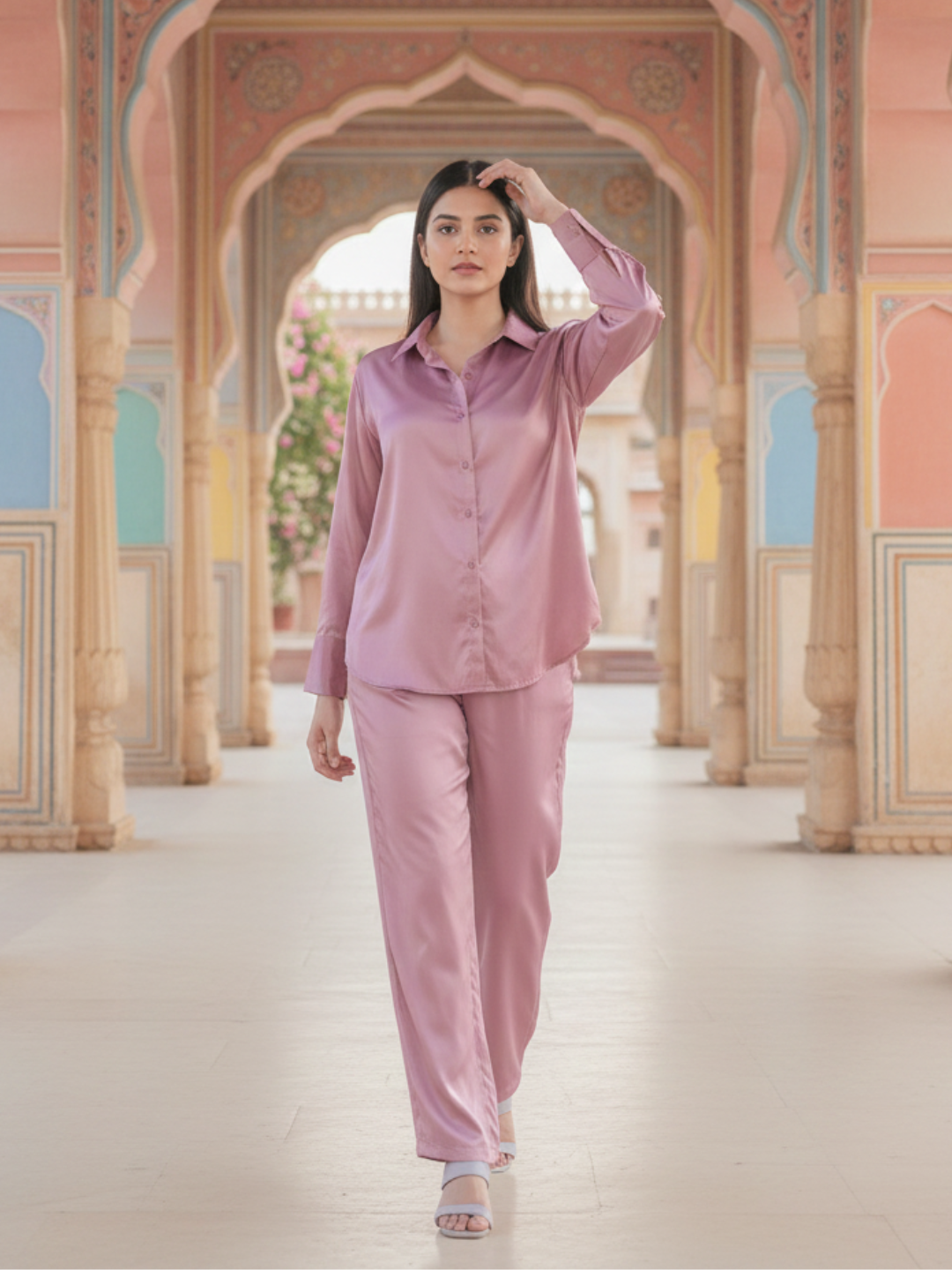 Model wearing light pink satin co-ord set with relaxed fit shirt and pants