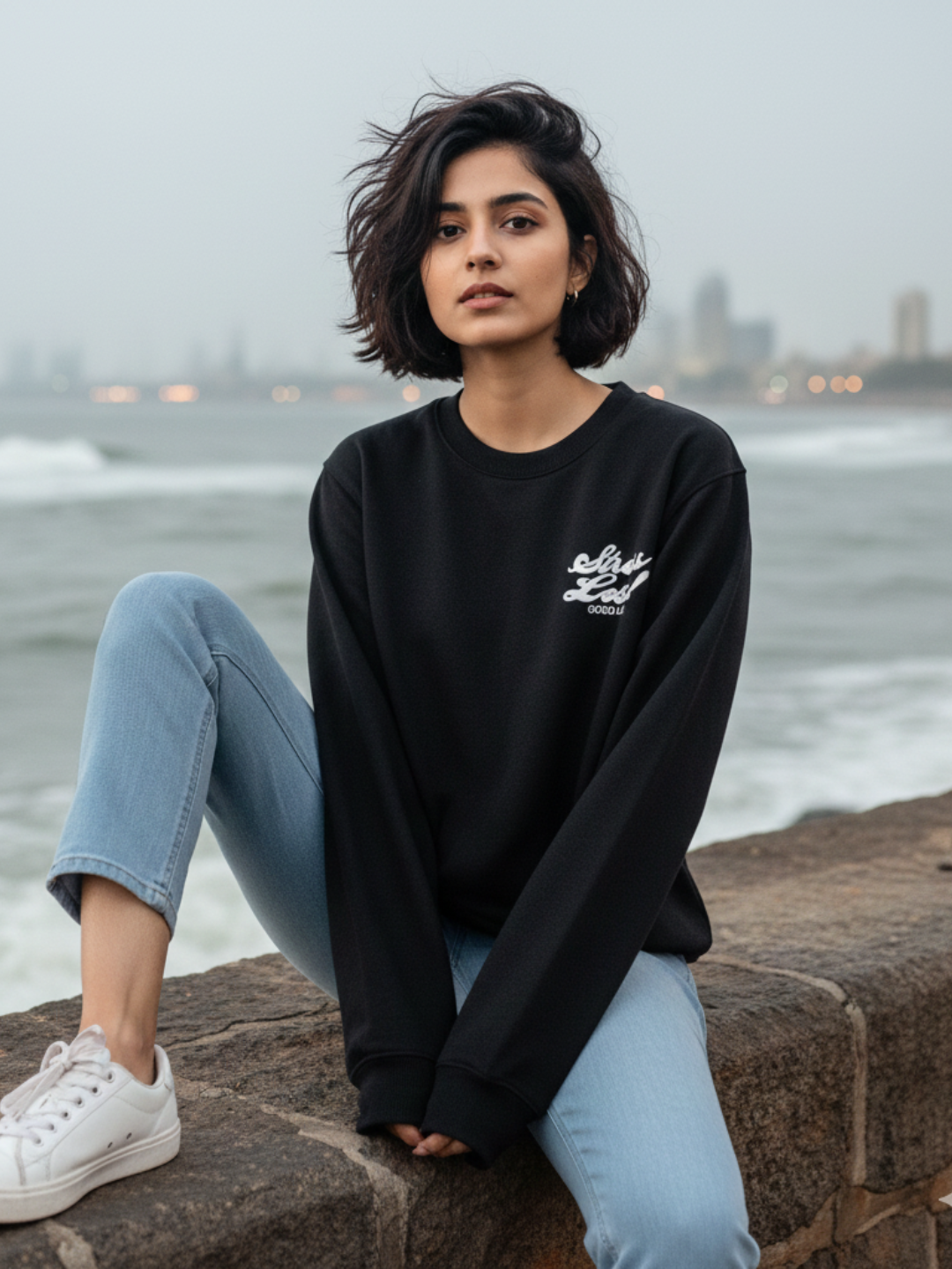 Front view of black relaxed sweatshirt for women