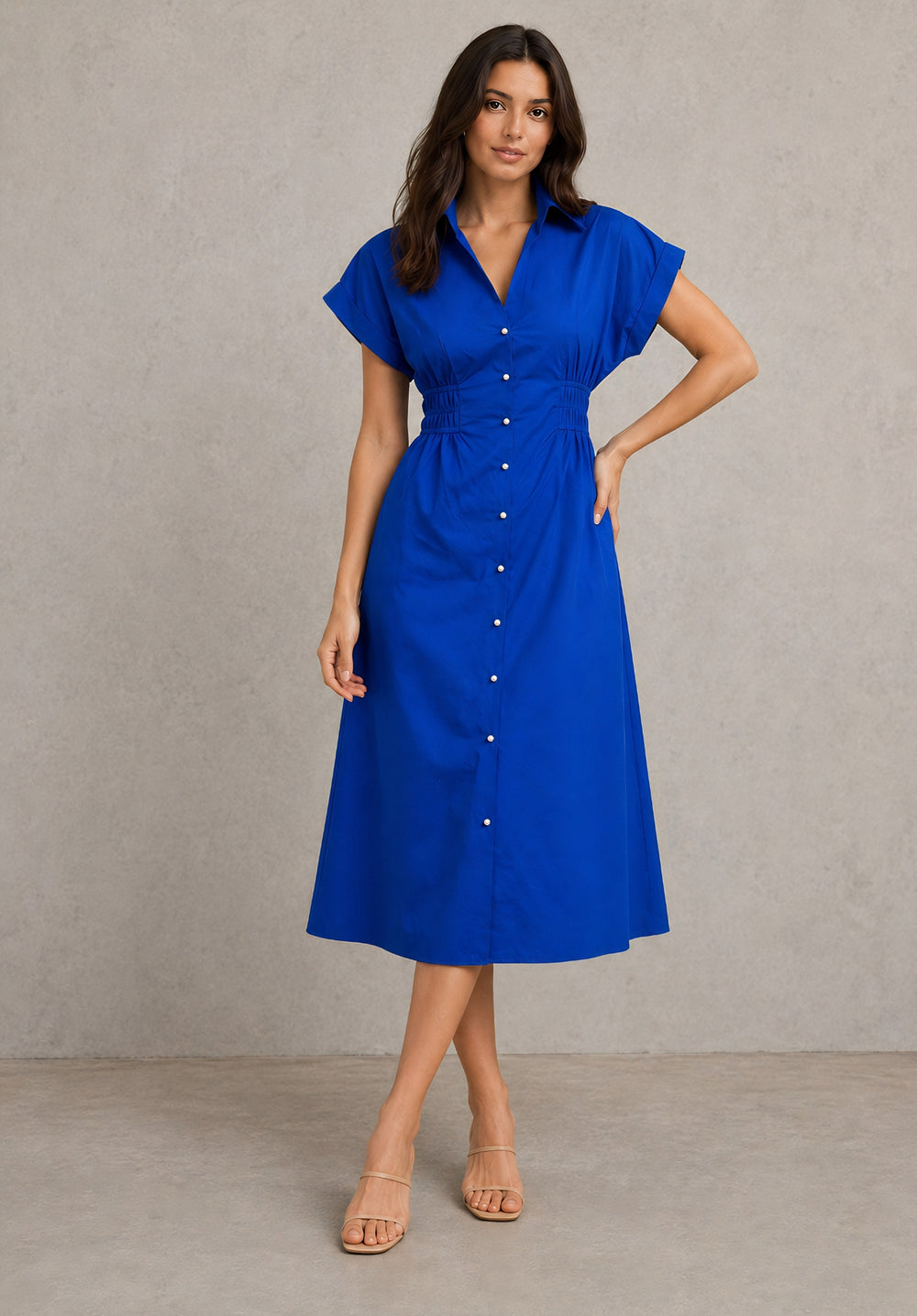 Side view showing the flared A-line skirt and gathered waist