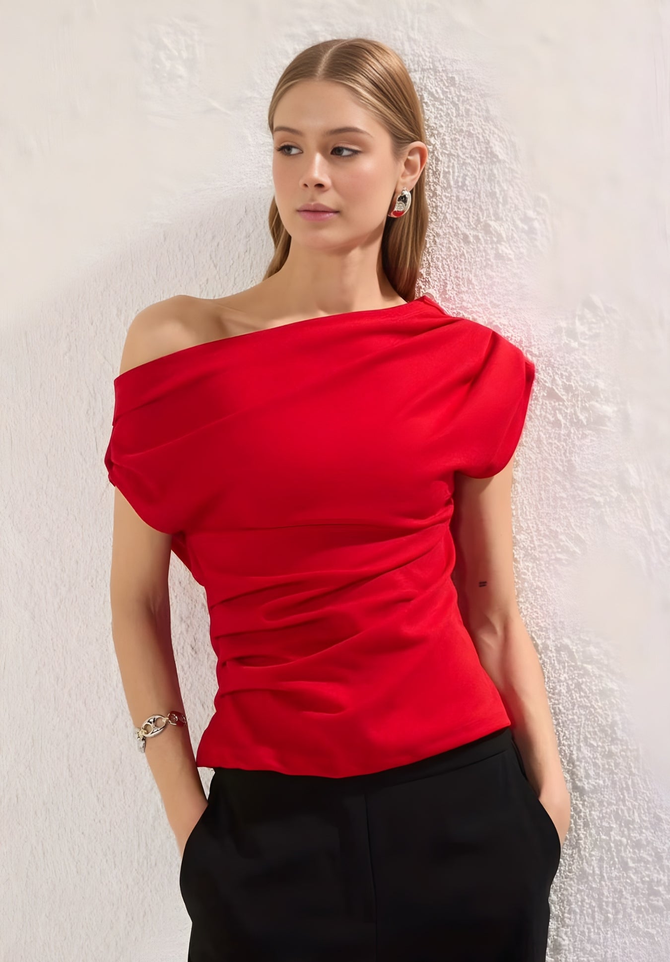 Side view of red one-shoulder asymmetric top
