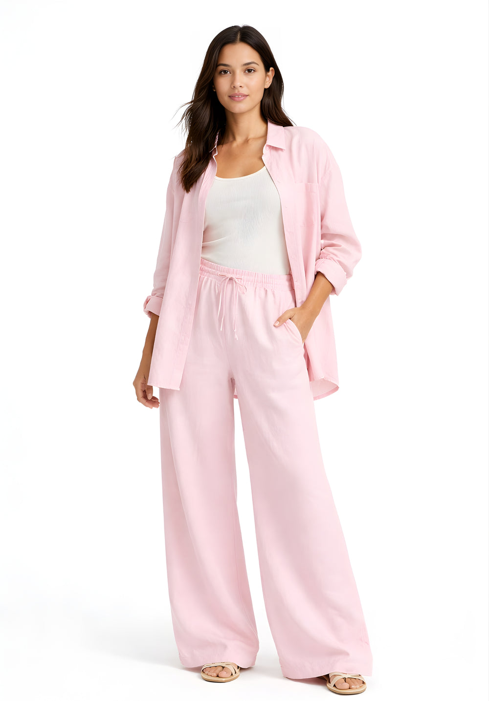Side view of relaxed-fit light pink linen baggy trousers with drawstring waist