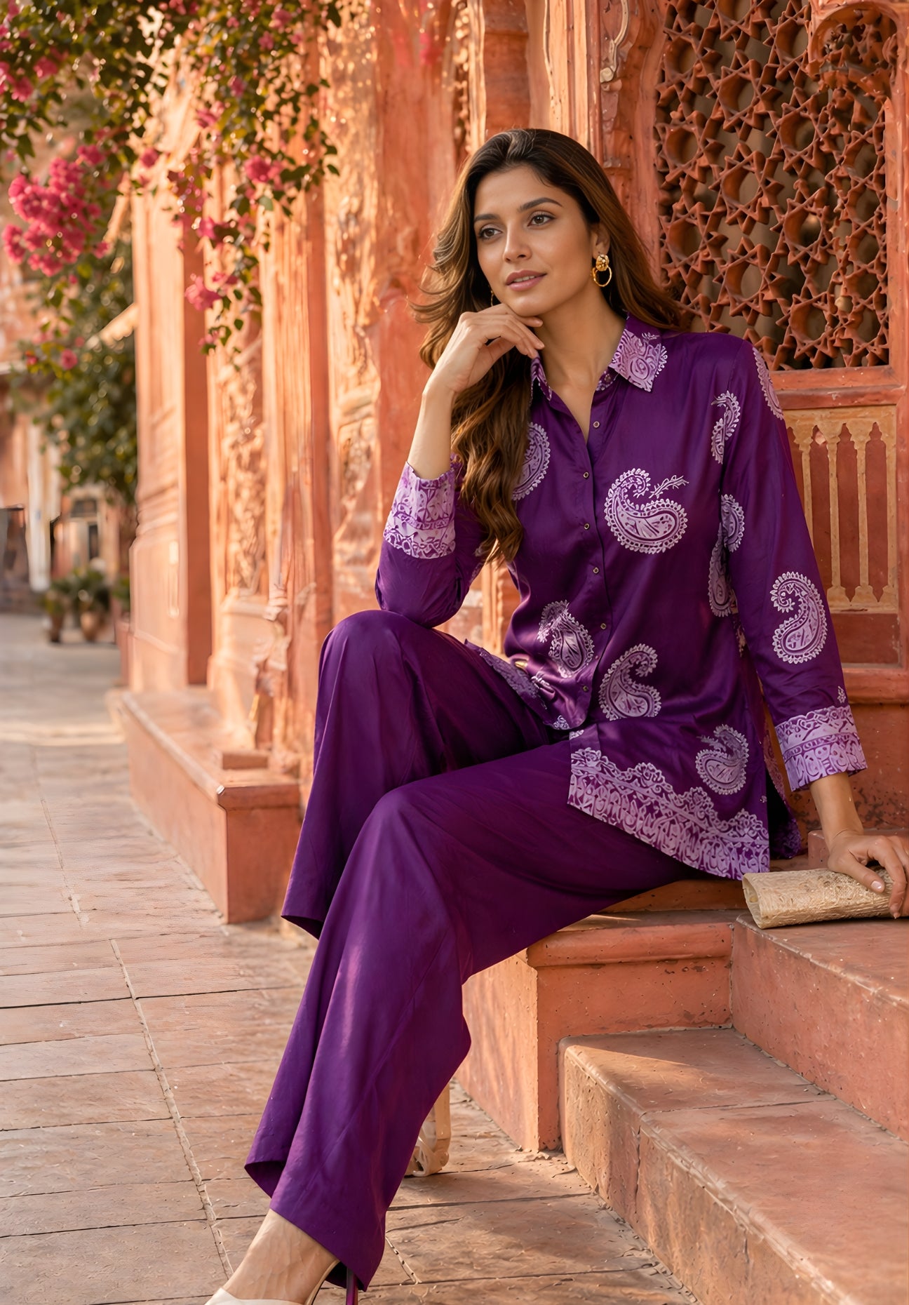 Side view of purple satin co-ord set showing relaxed fit and curved hem