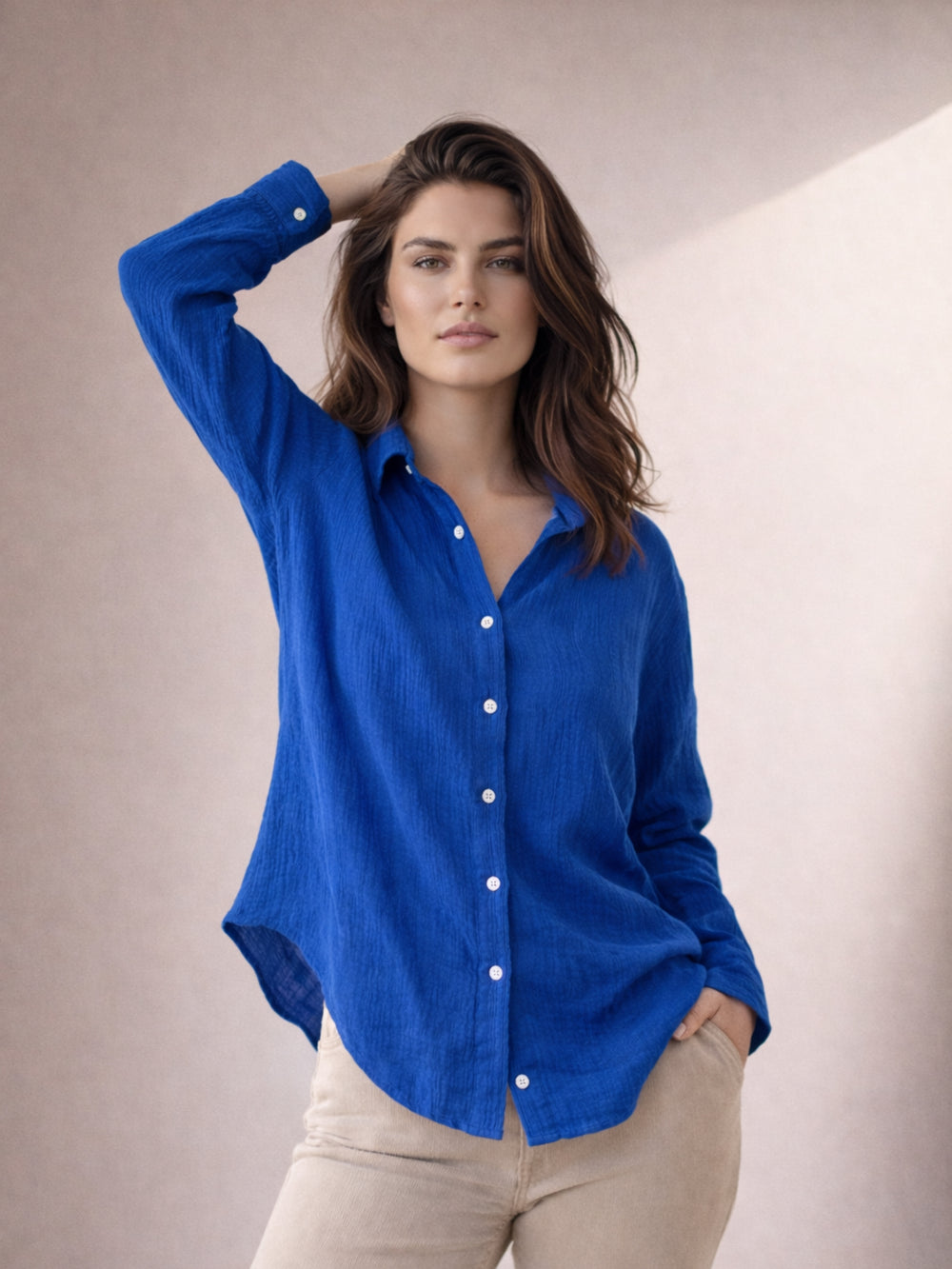 Side view of blue wrinkled cotton shirt with relaxed drape