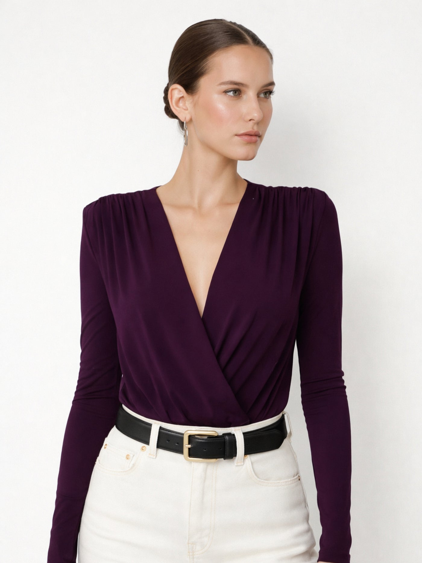 Close-up of V-neckline on maroon polyester bodysuit top