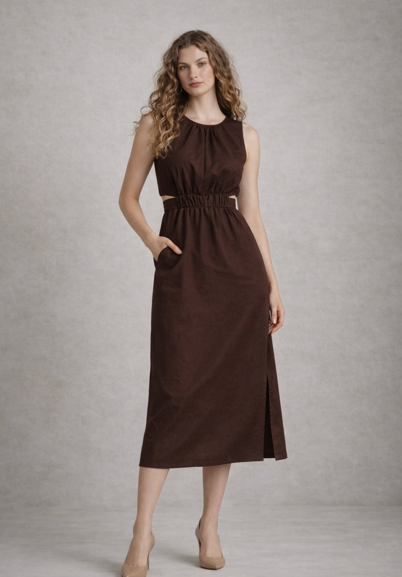 Side angle of brown A-line cotton dress showing flared skirt