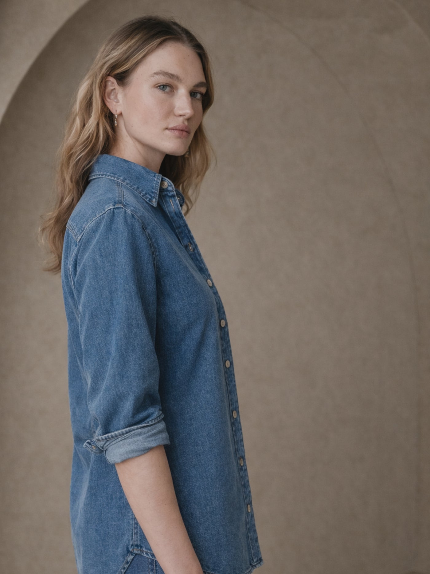 Close-up of chest pocket on blue denim shirt