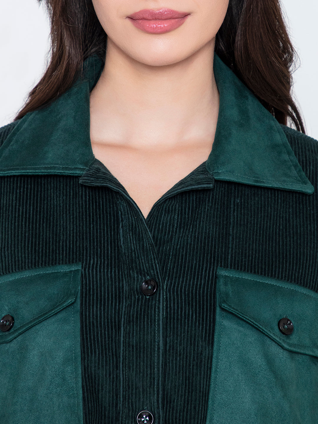 Detail of spread collar and button placket on green shacket