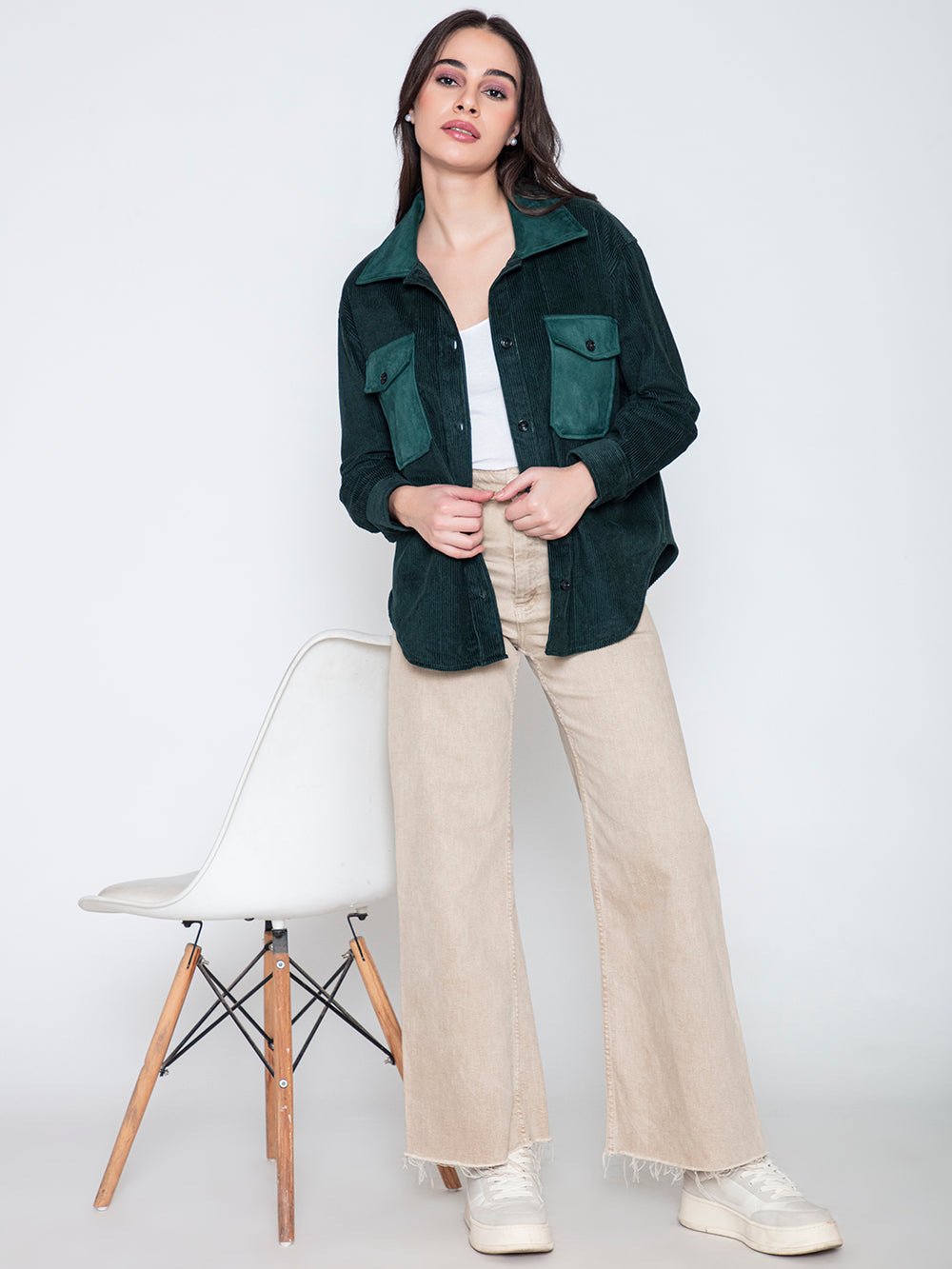 Side angle of green corduroy shacket layered open