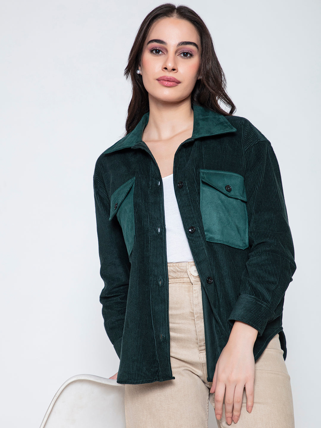 Styling shot of green corduroy shacket with denim