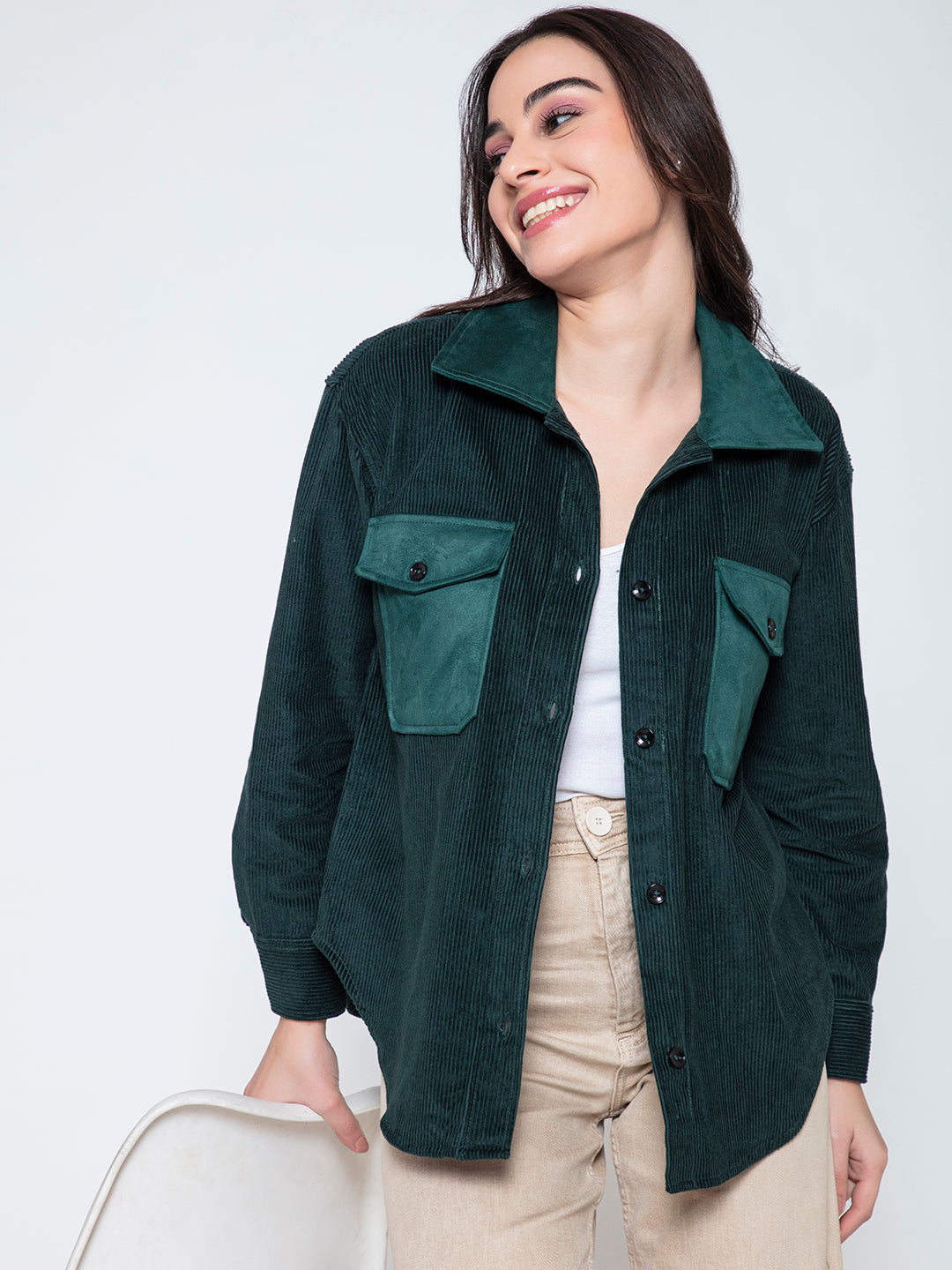 Front view of green oversized corduroy shacket for women