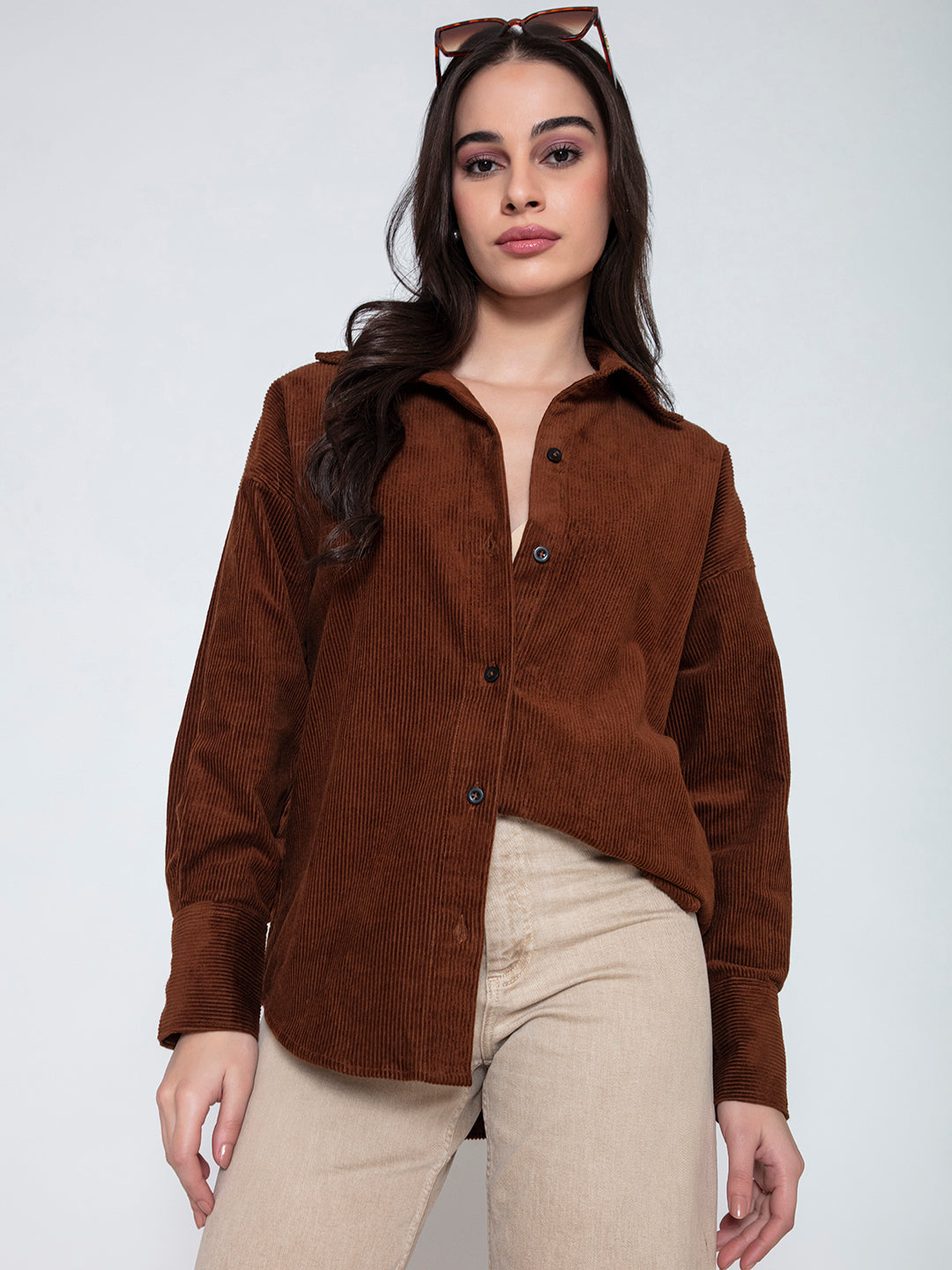 Front view of brown oversized corduroy shirt for women