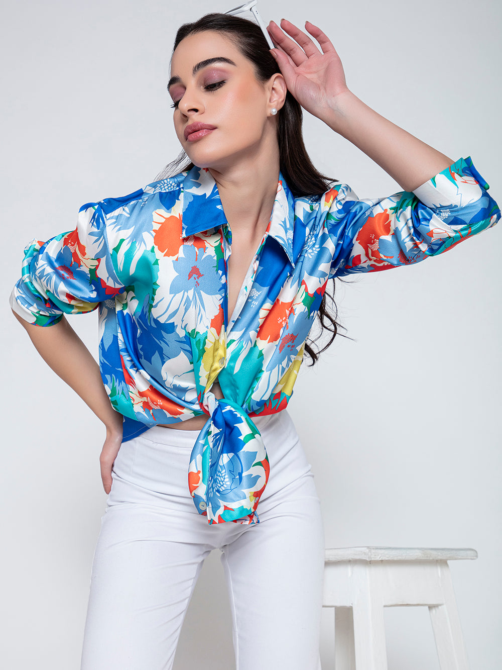 Side angle of blue floral print satin shirt