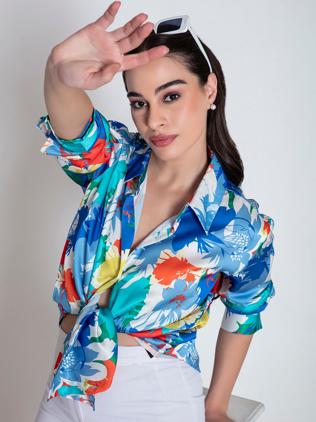 Front view of blue floral satin relaxed shirt for women