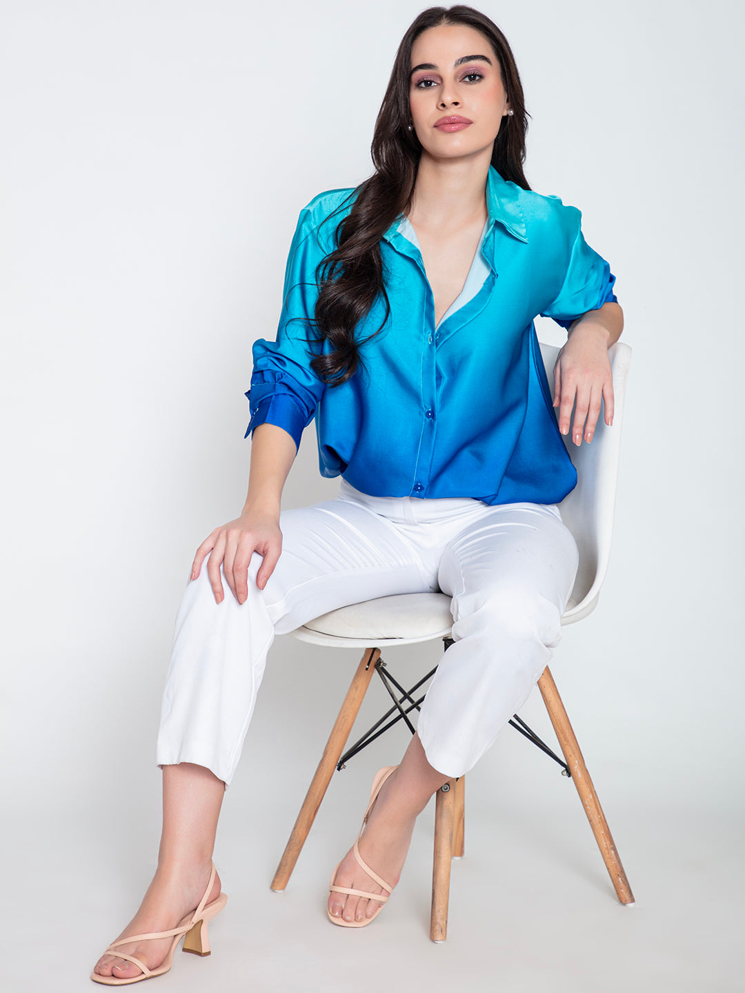 Lifestyle shot of model wearing blue ombre satin shirt