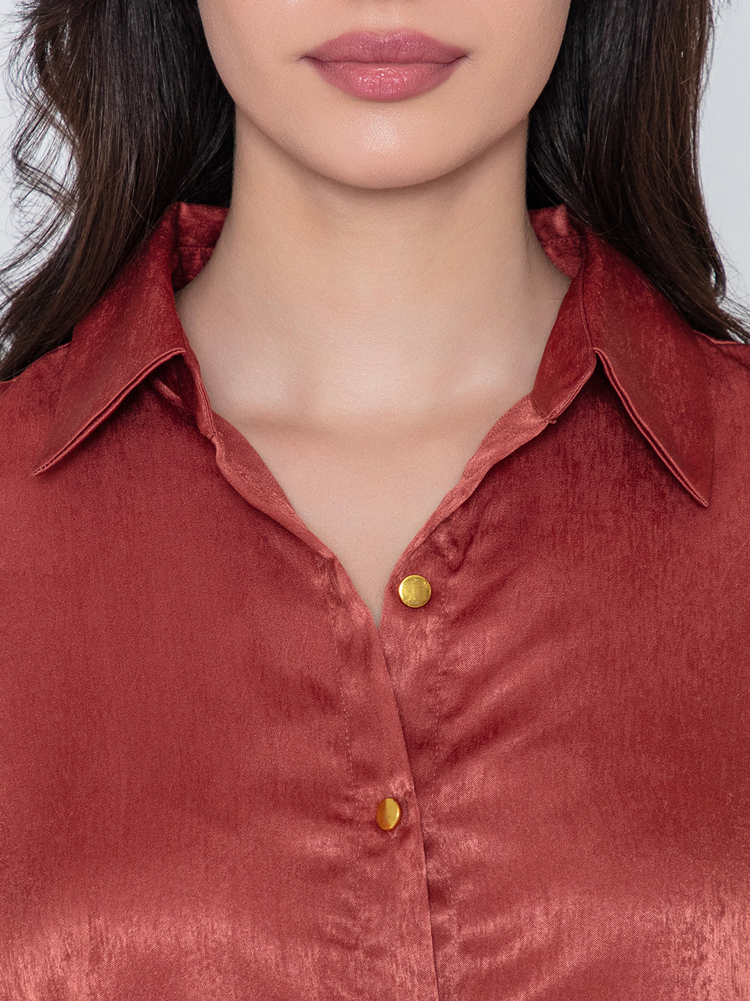 Close-up of lustrous maroon satin fabric
