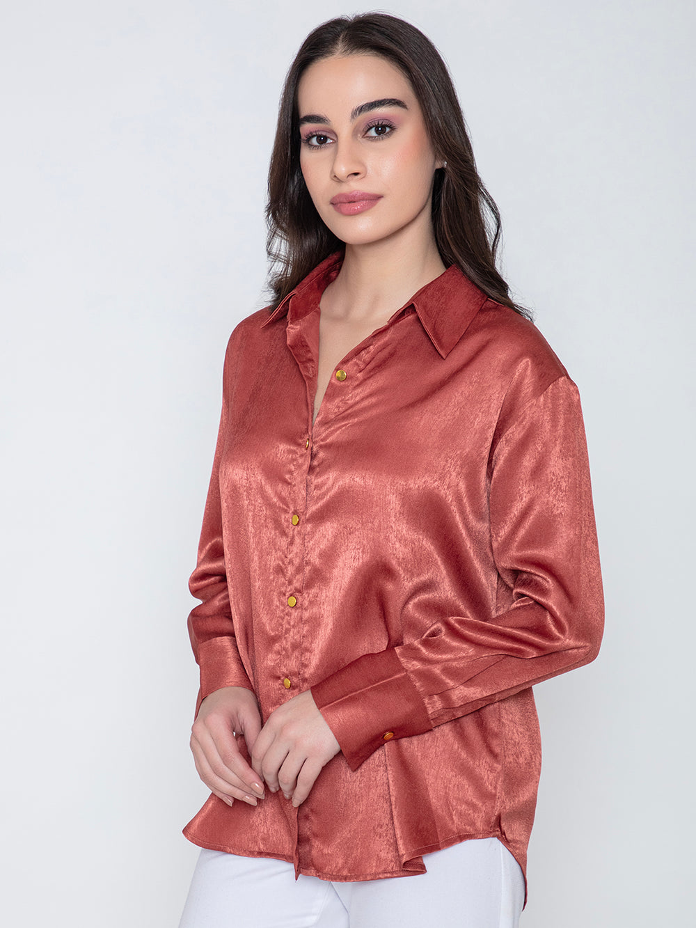 Side angle of maroon satin shirt with soft drape
