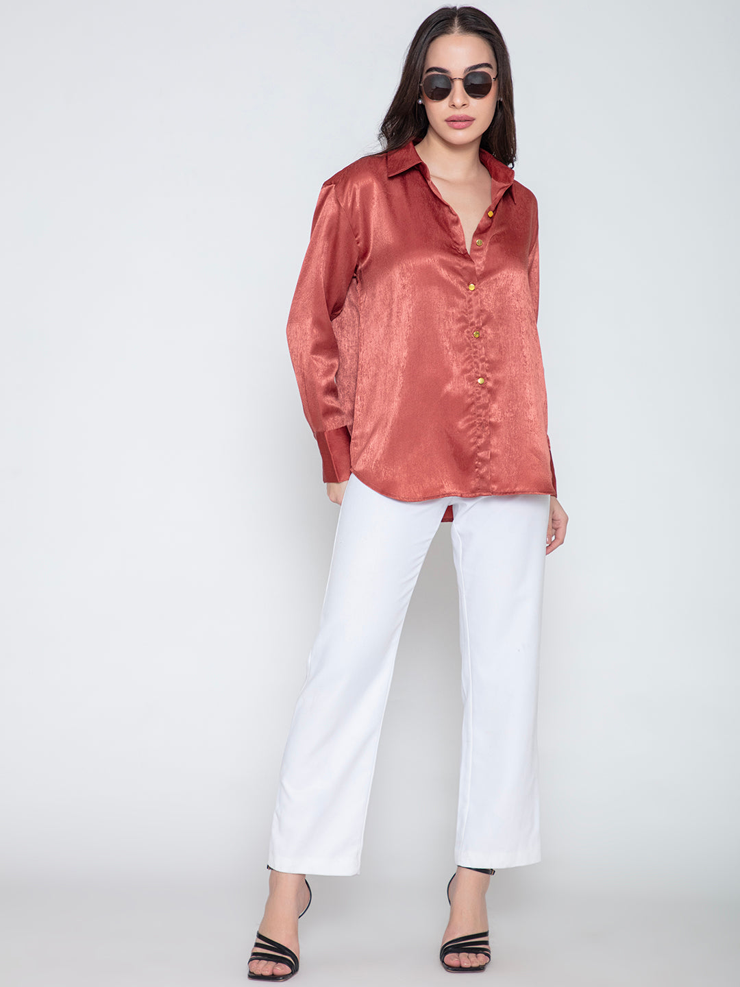 Detail of spread collar and button placket on maroon satin shirt