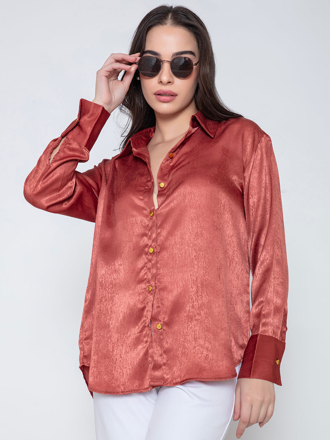 Lifestyle shot of model wearing maroon satin relaxed shirt