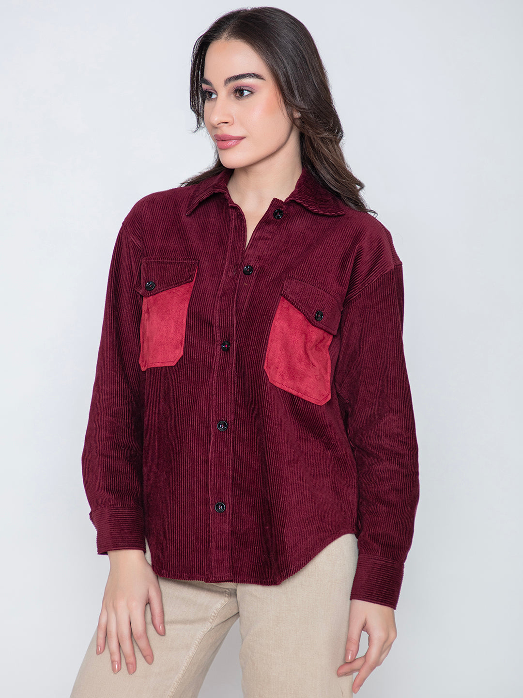 Close-up of plush corduroy texture in maroon shacket