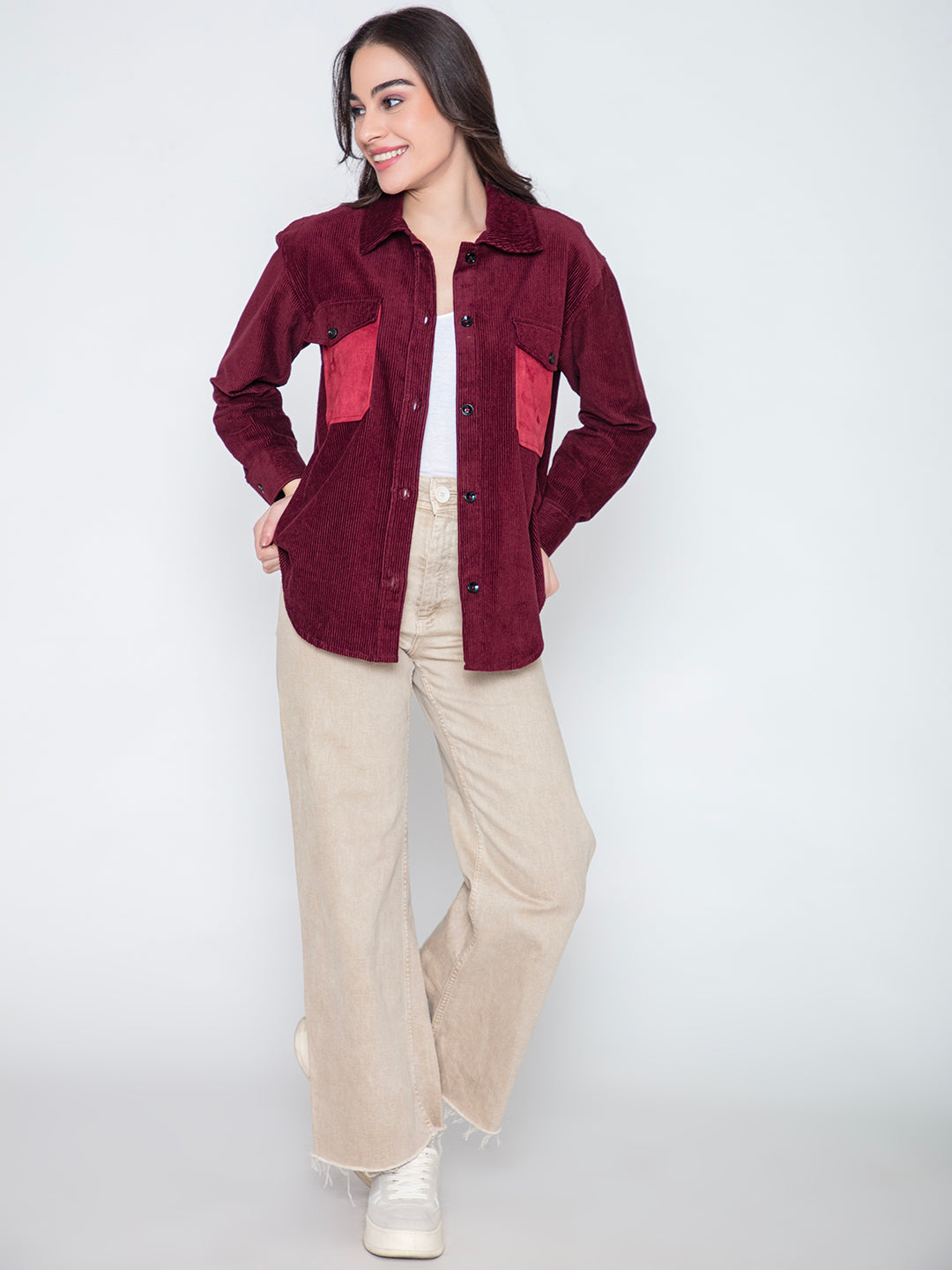 Detail of spread collar and button placket on maroon shacket
