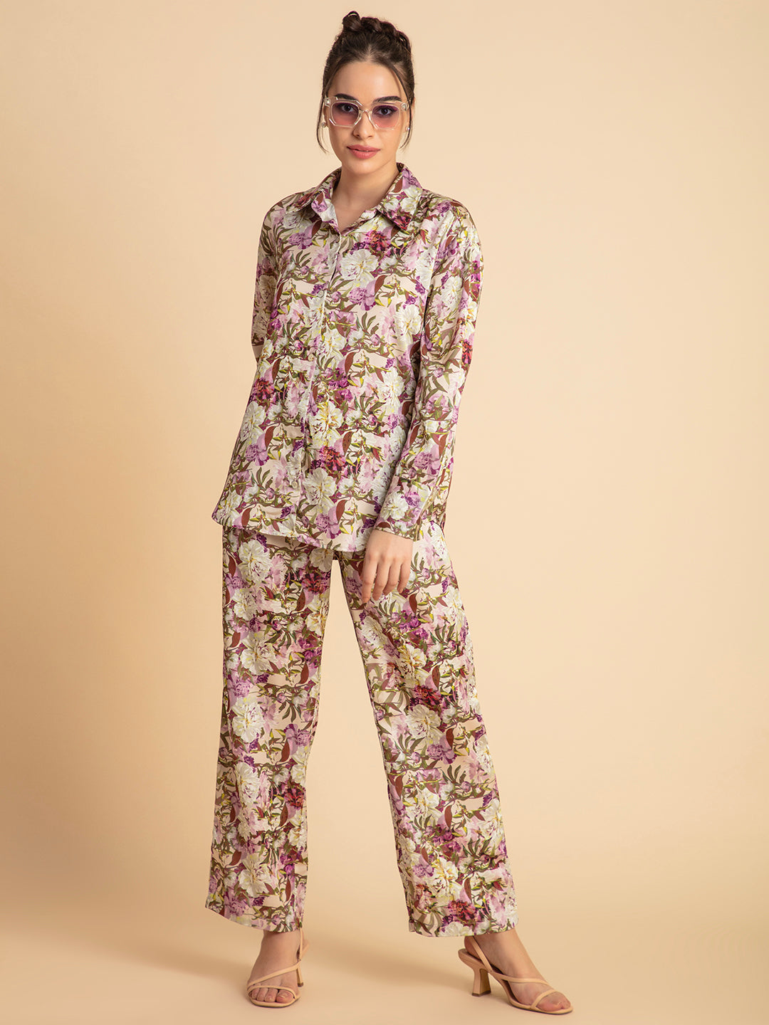 Curved hemline detail on purple floral satin shirt