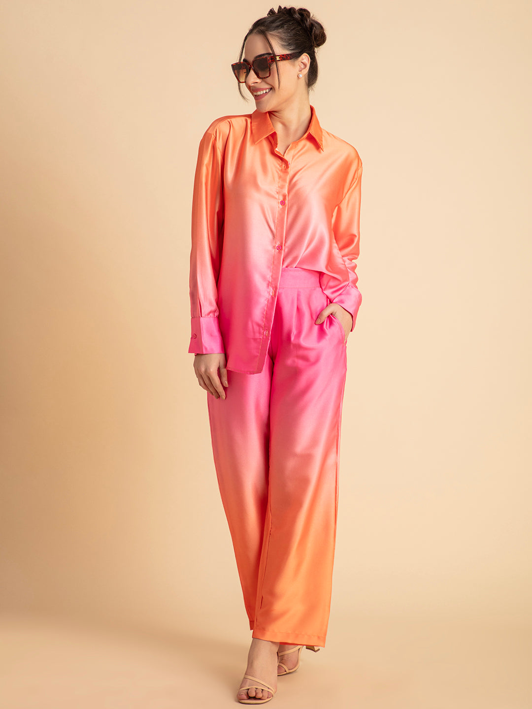 Lifestyle shot of model wearing pink ombre satin co-ord