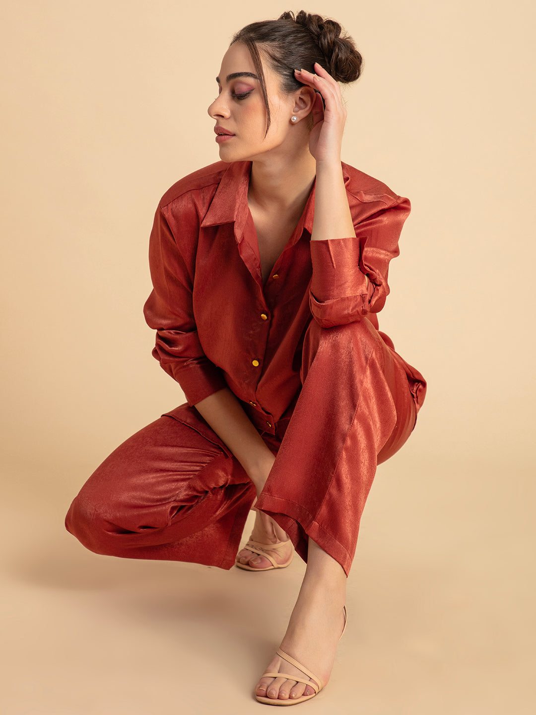 Detail of elastic waist on maroon satin trouser