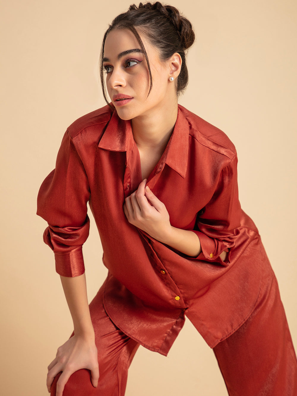 Side angle of maroon satin co-ord set