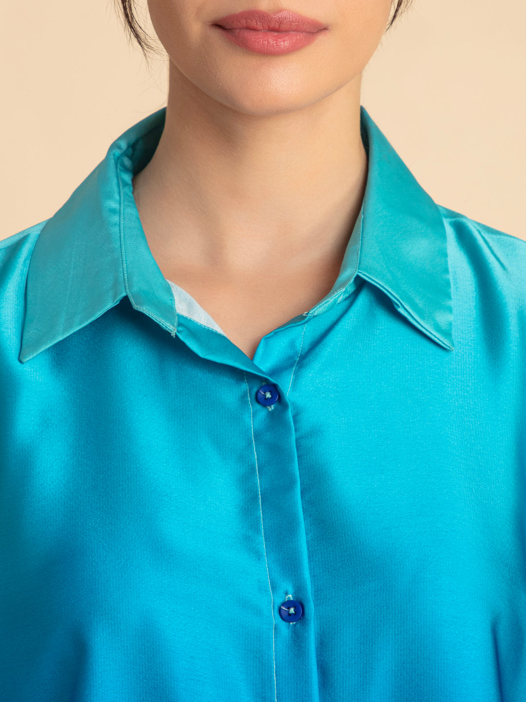 Lifestyle shot of model wearing blue ombre satin co-ord