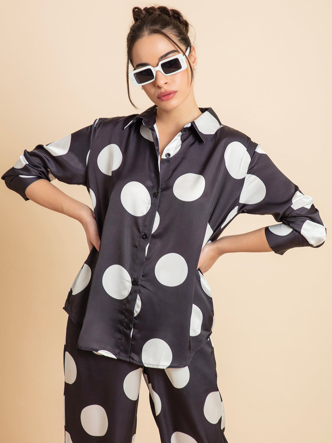 Side view of polka dot satin shirt and pant set