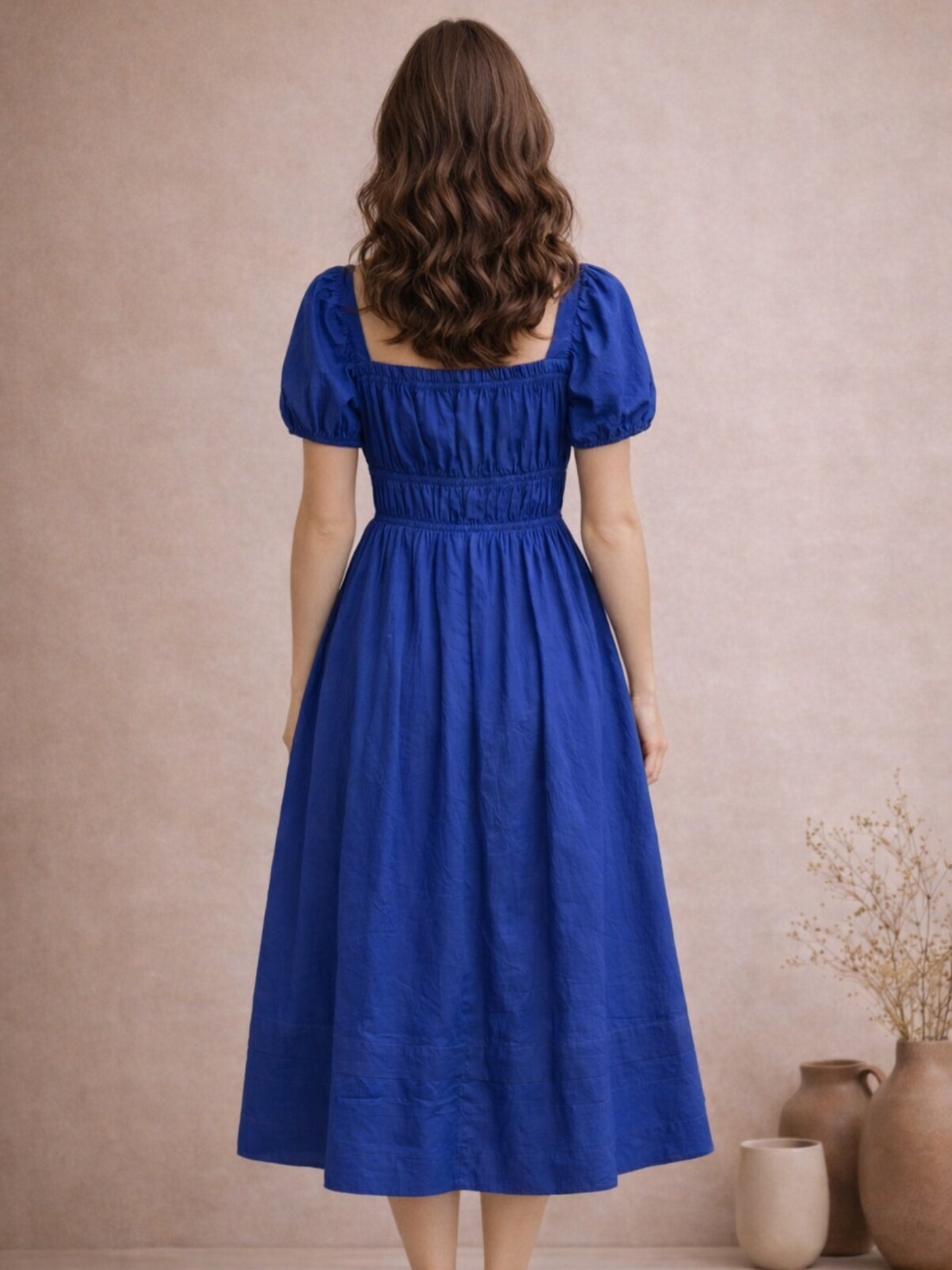Back view of blue A-line midi dress in pure cotton