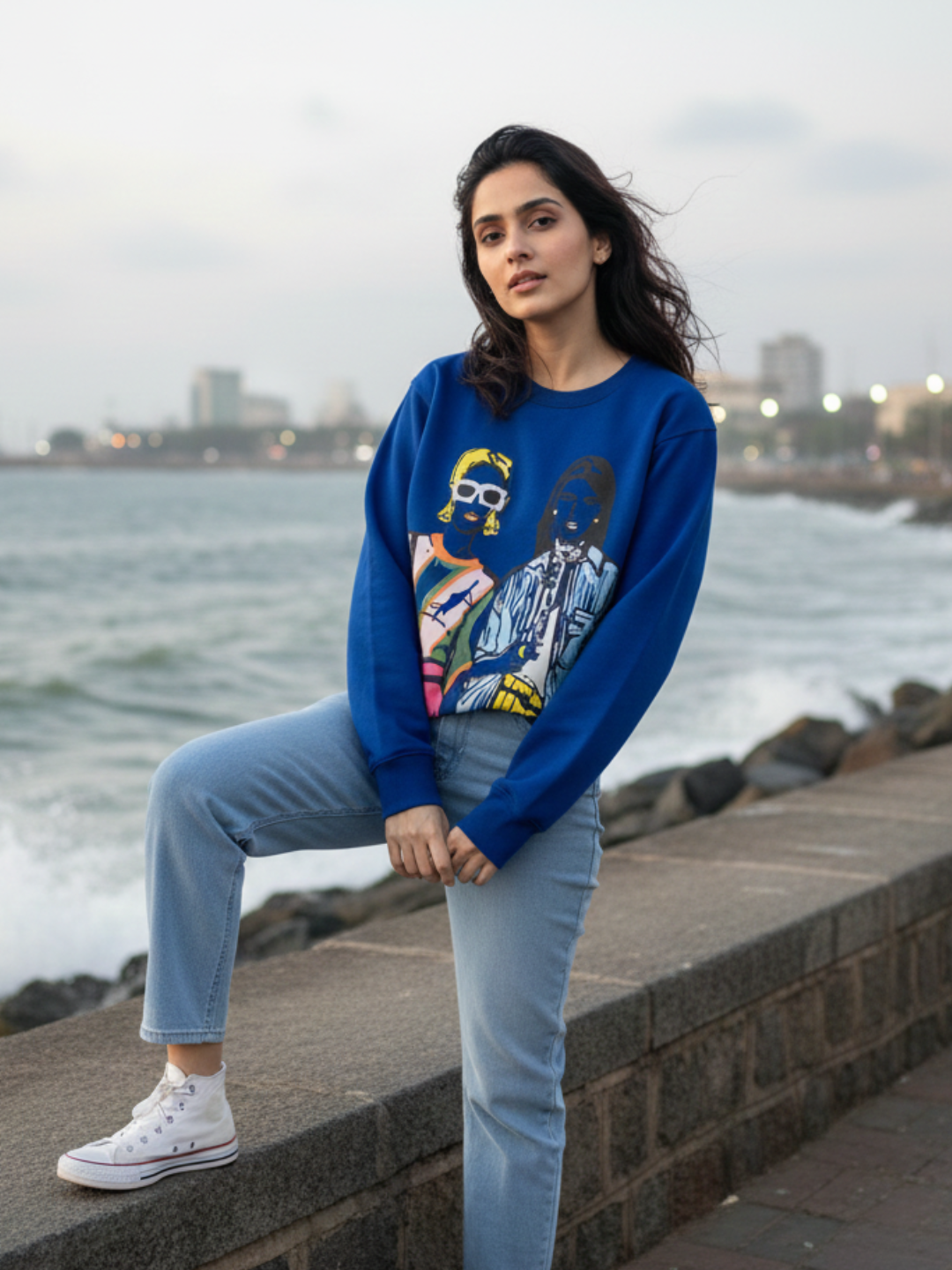 Front view of blue illustrated print sweatshirt for women