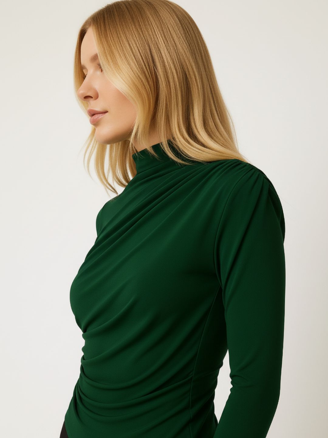 Close-up of high neckline on green polyester top