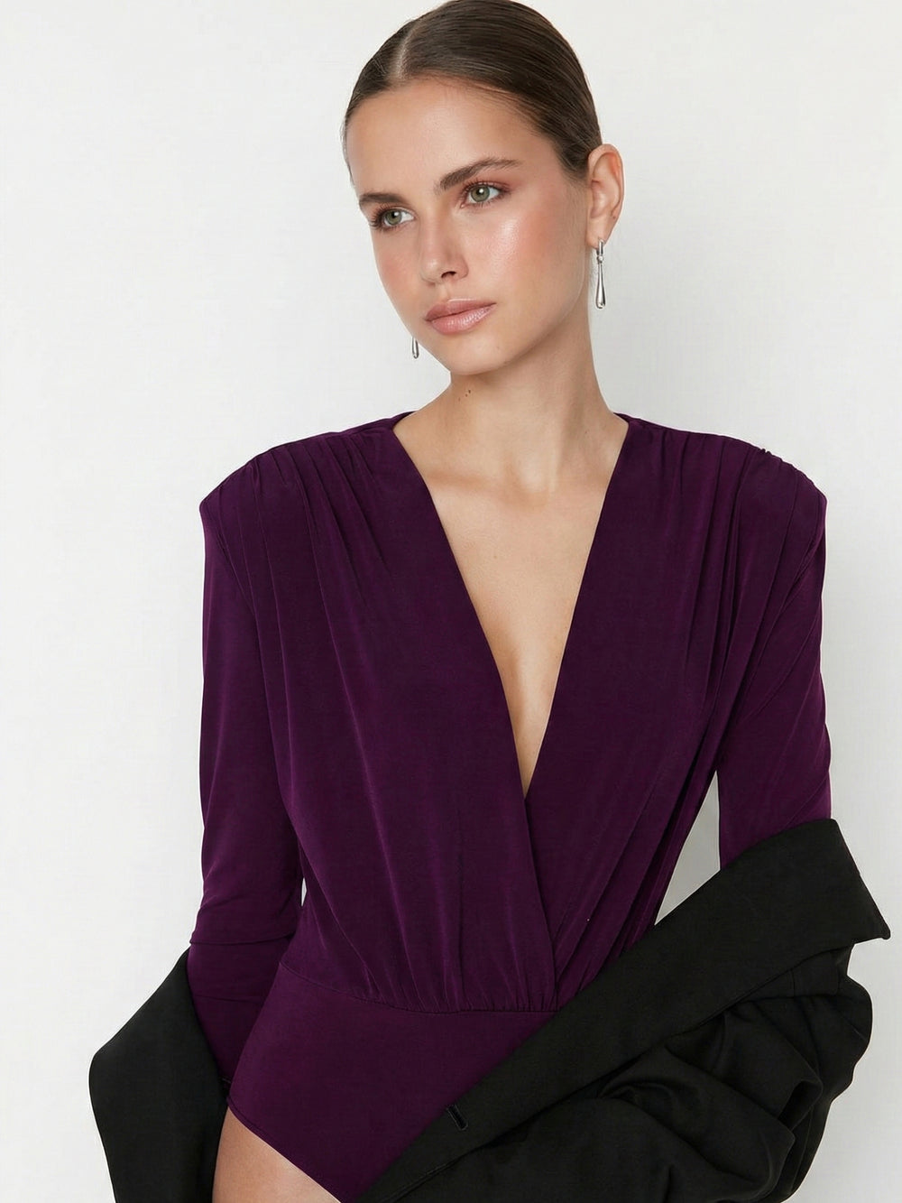 Side view of maroon V-neck long-sleeve bodysuit top