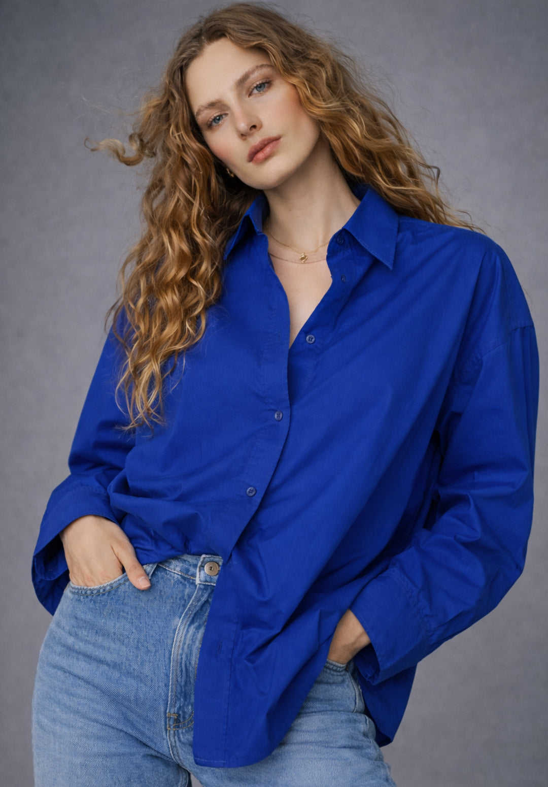 Front view of royal blue cotton poplin oversized shirt for women