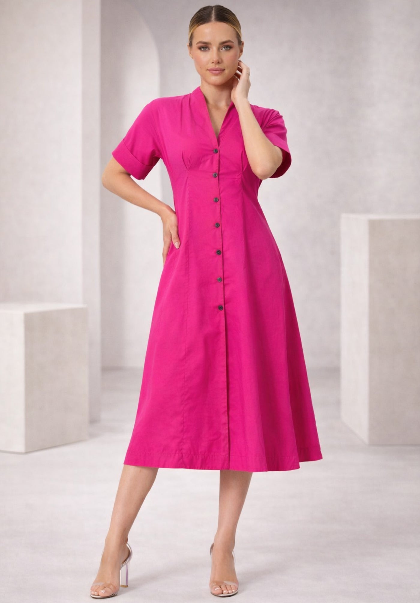 Close-up of buttoned front and collar on pink cotton dress