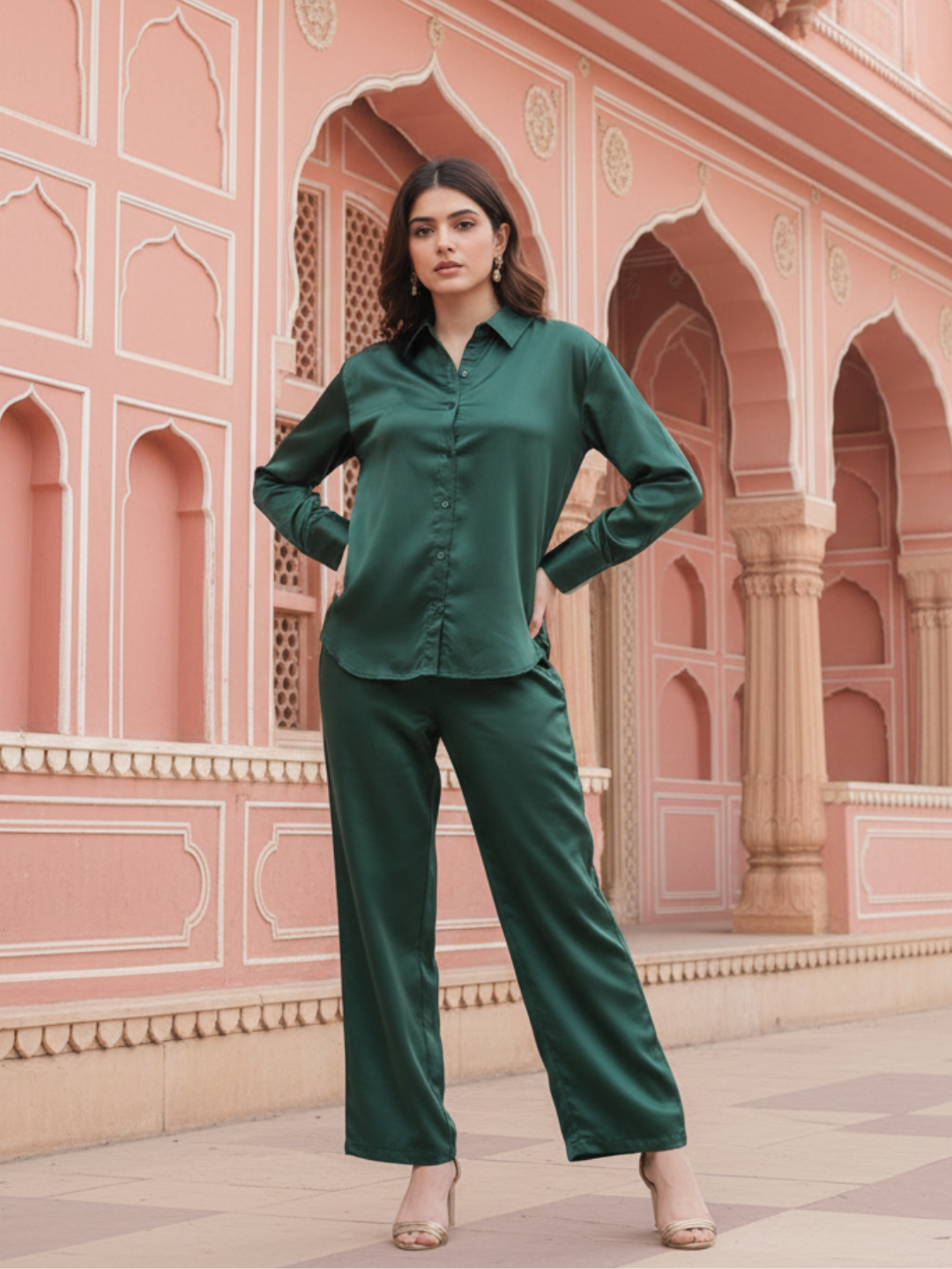 Model wearing dark green satin co-ord set with relaxed fit shirt and pants