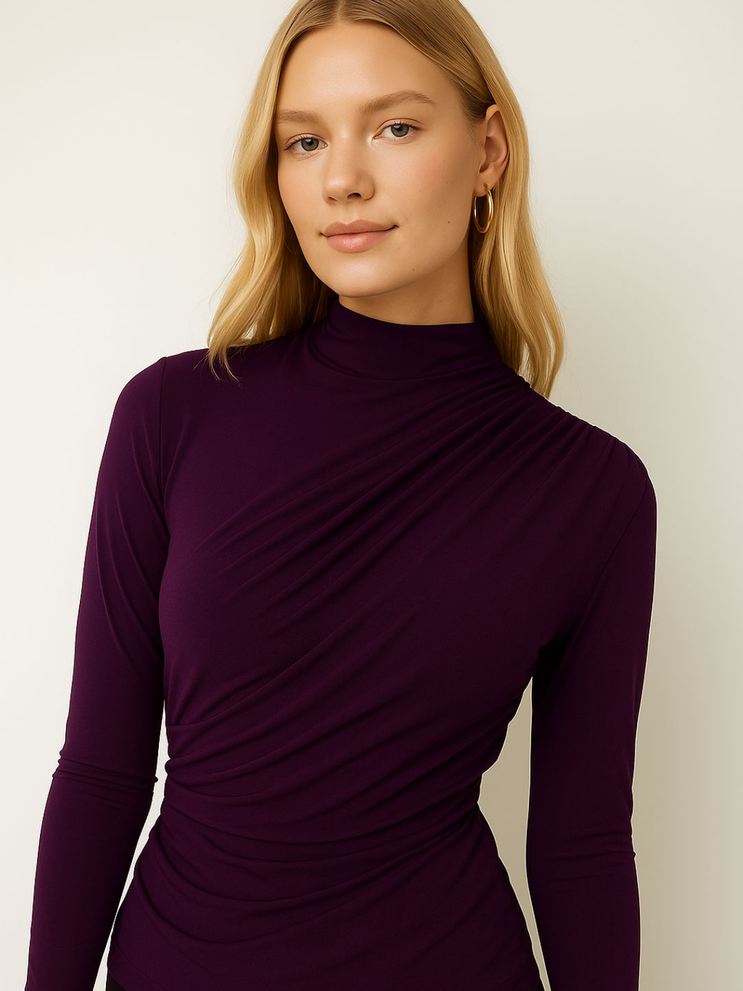 Side angle of maroon high neck top showing fitted silhouette