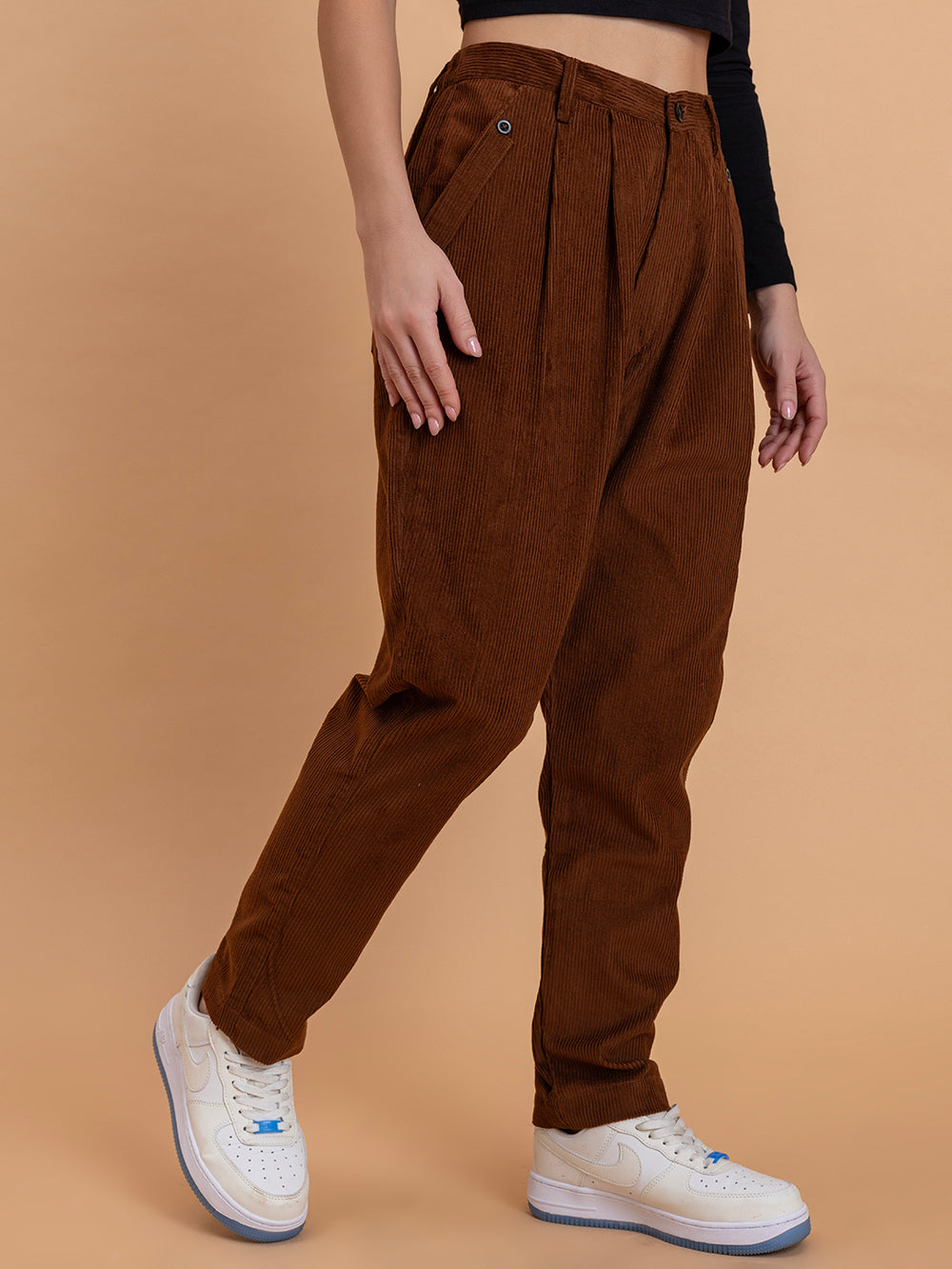 Side view of brown corduroy relaxed-fit trousers