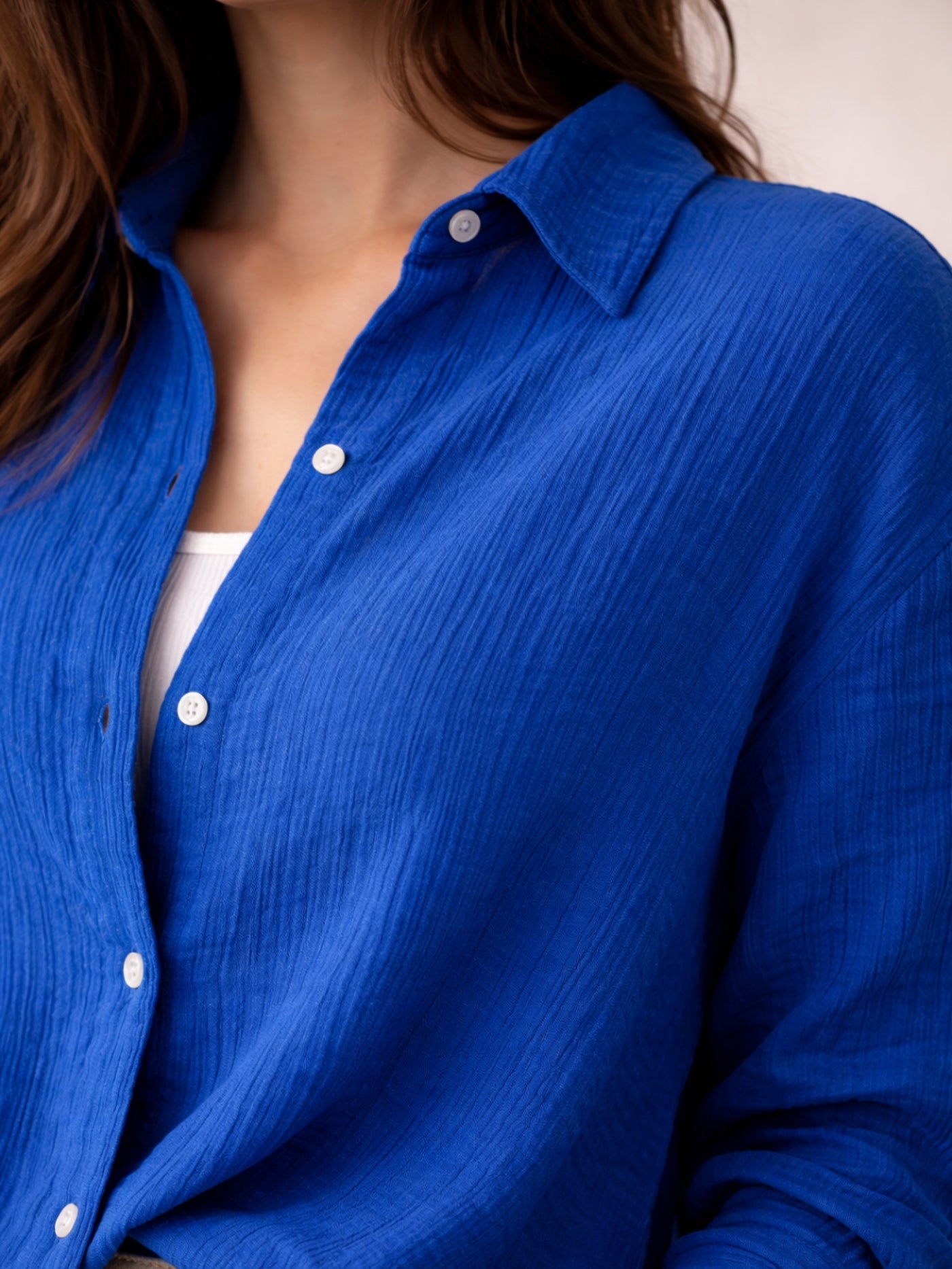 Close-up of blue wrinkled cotton fabric texture