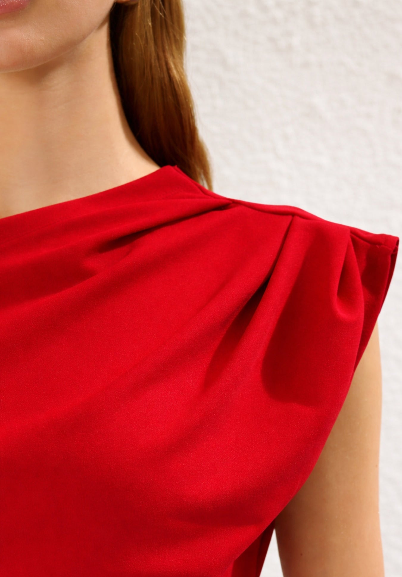 Back view of red one-shoulder off-shoulder top